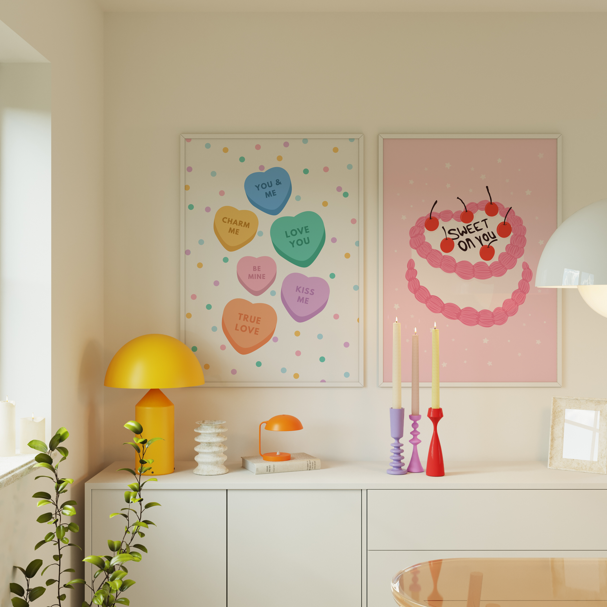 An image showing two prints in frames, one of love hearts and one of a cake saying 'sweet on you.'