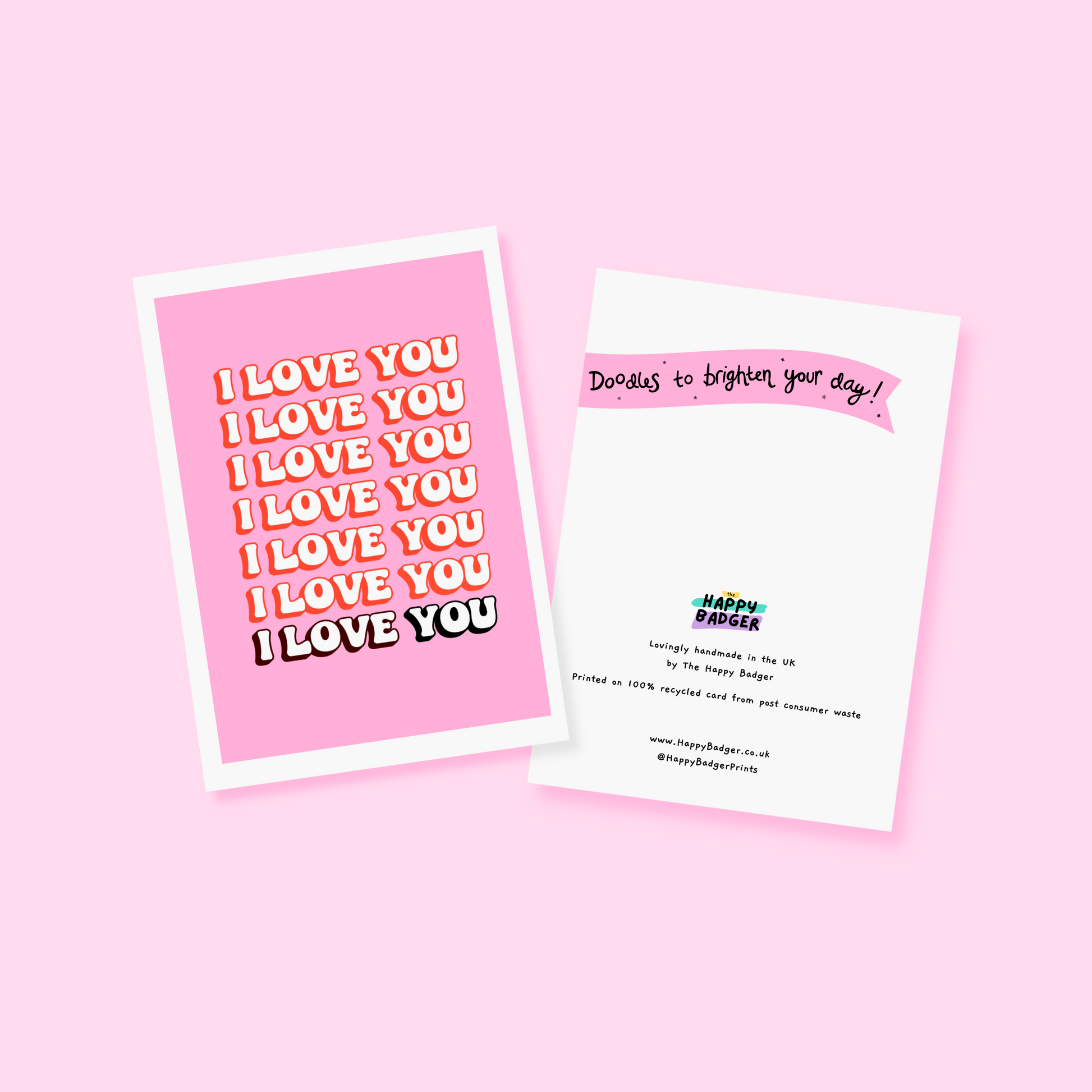 a pink card, with the words I love you, repeating across the front of the card.