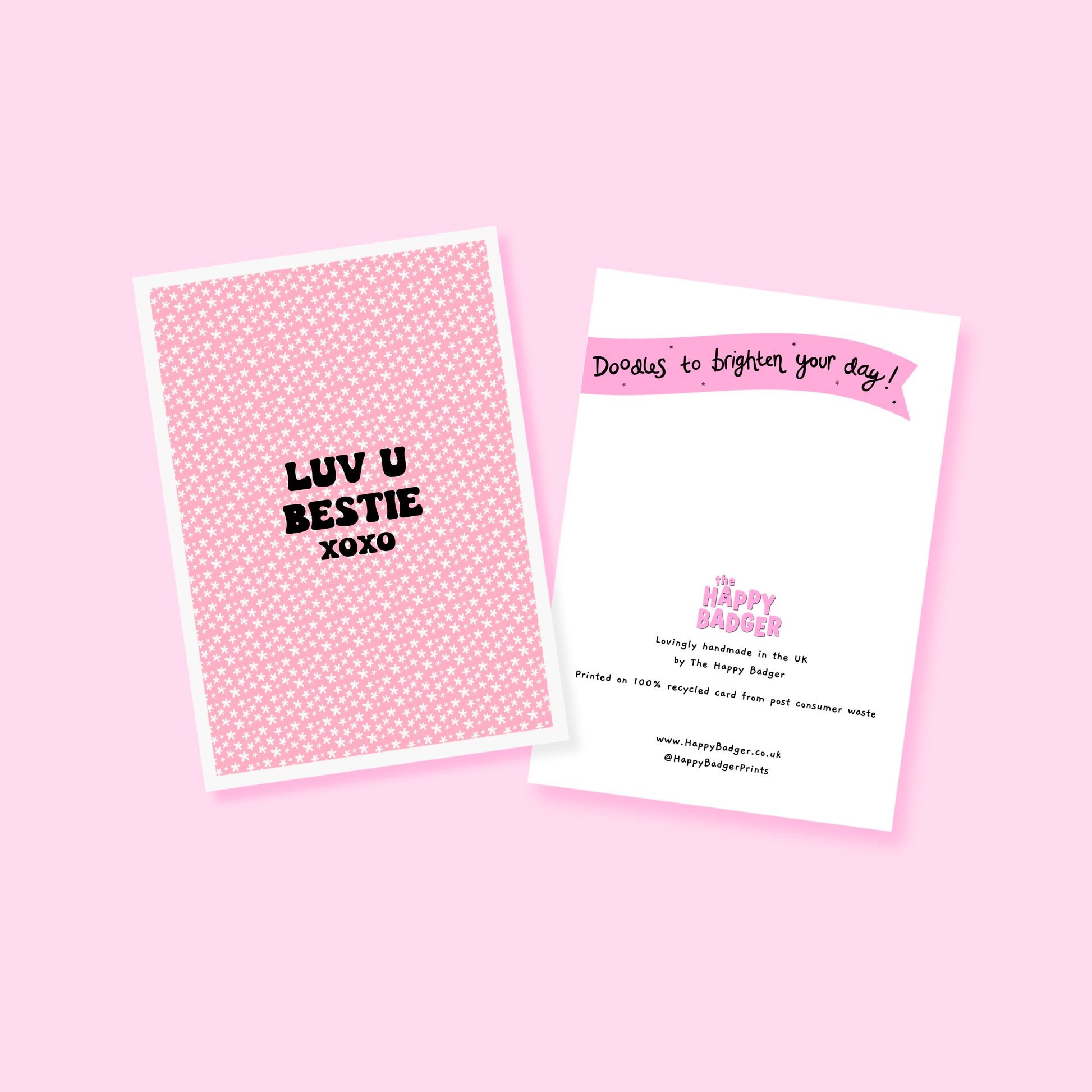 A pink card with little flowers all over, and black writing that says "Luv U Bestie xoxo".