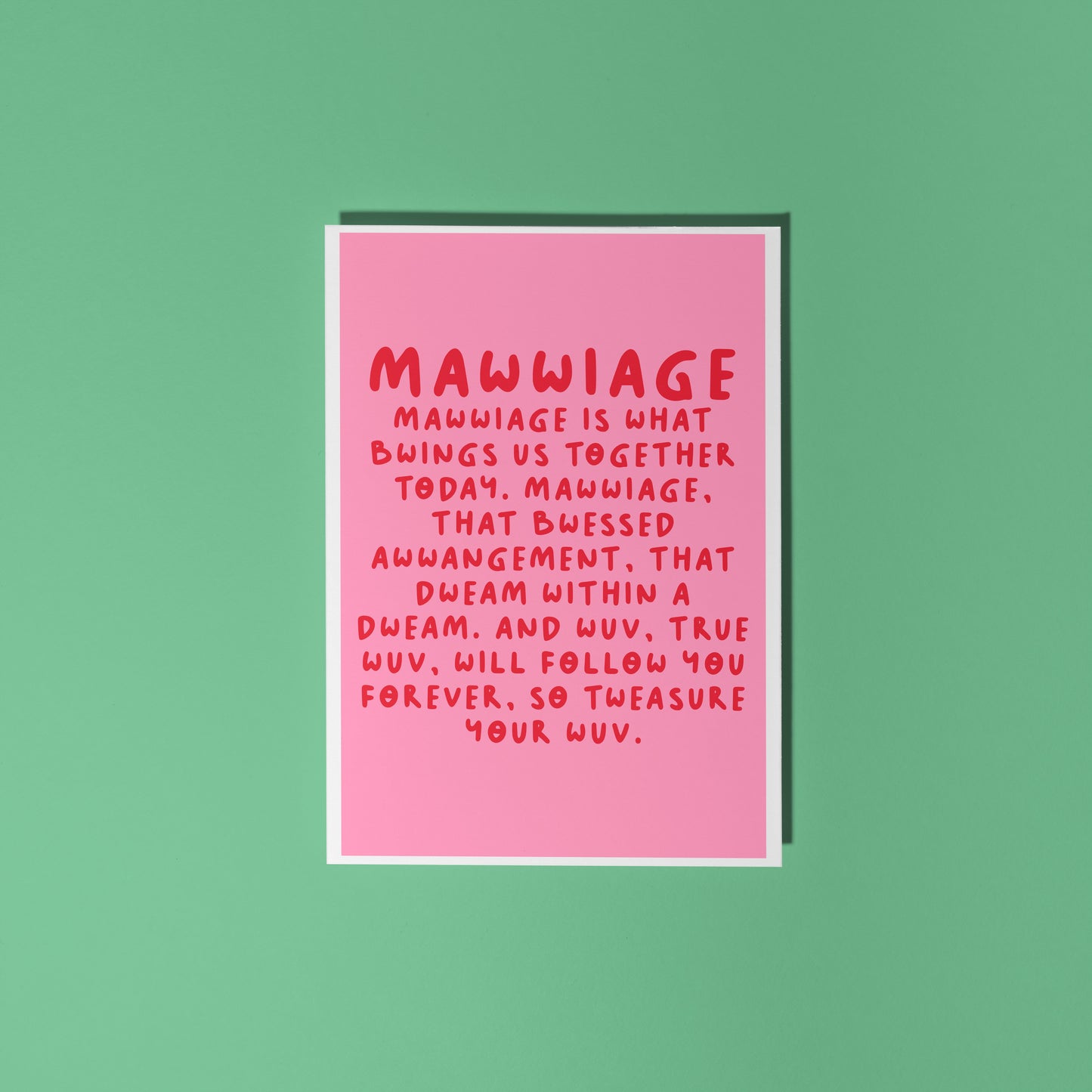 A pink wedding day celebration card, with a quote in red, from the film The Princess Bride.