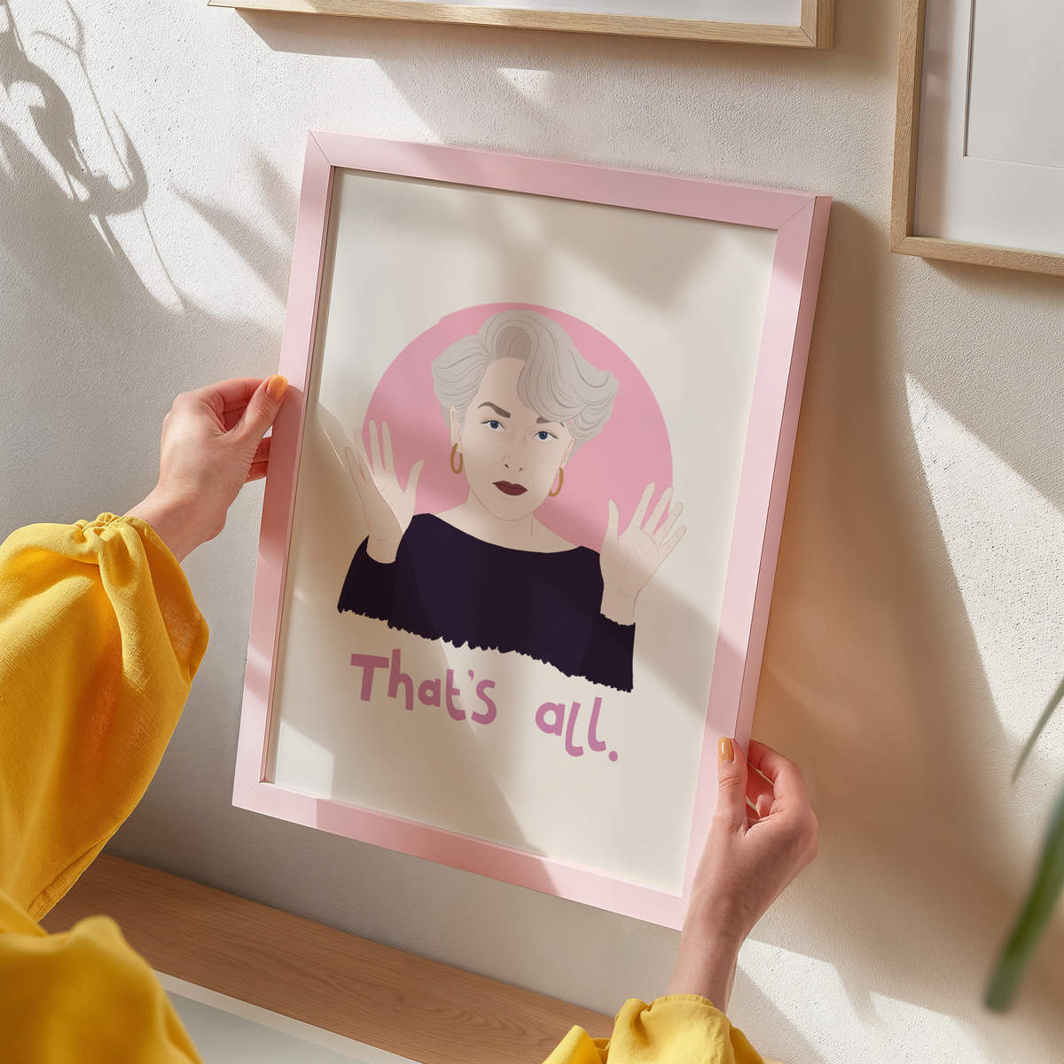A portrait print of Miranda Priestly from The Devil Wears Prada, featuring her quote 'that's all.' underneath.