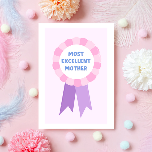 A Mother's Day card, with a pink and purple rosette and the words 'Most Excellent Mother' written on the rosette.