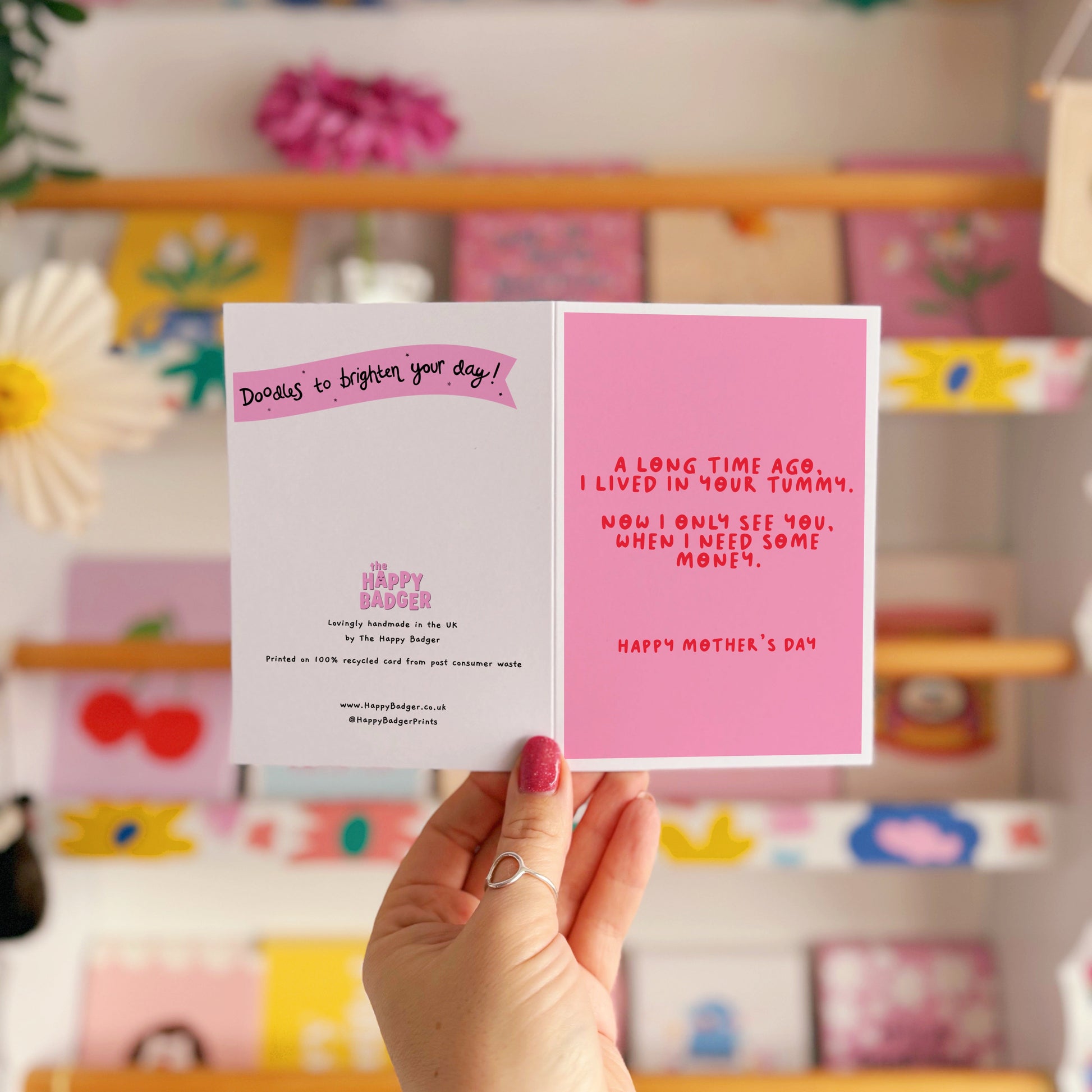 A pink Mother's Day card with a funny quote, that says 'A long time ago I lived in your tummy. Now I only see you, when I need some money. Happy Mother's Day".