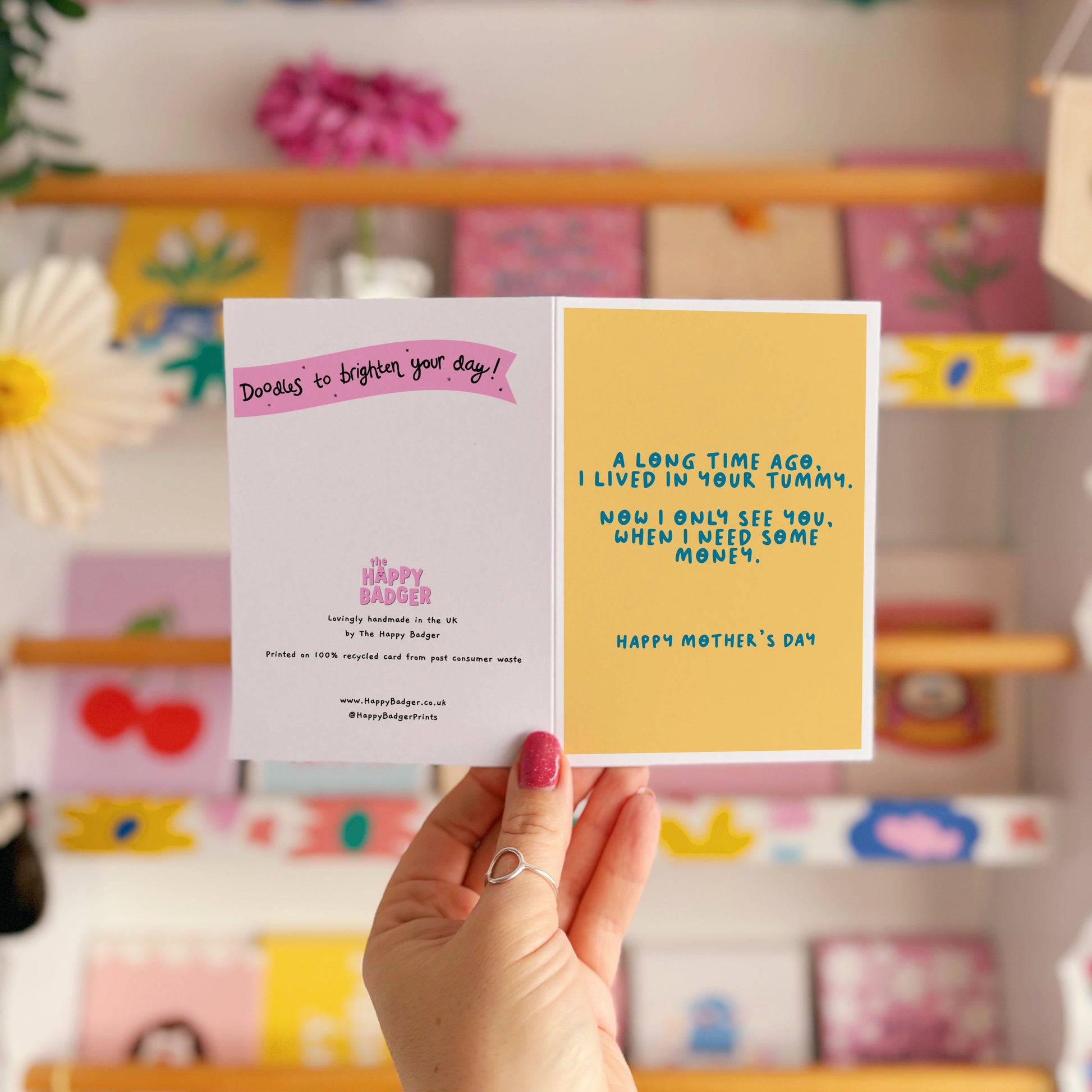 A yellow Mother's Day card with a funny quote, that says 'A long time ago I lived in your tummy. Now I only see you, when I need some money. Happy Mother's Day".