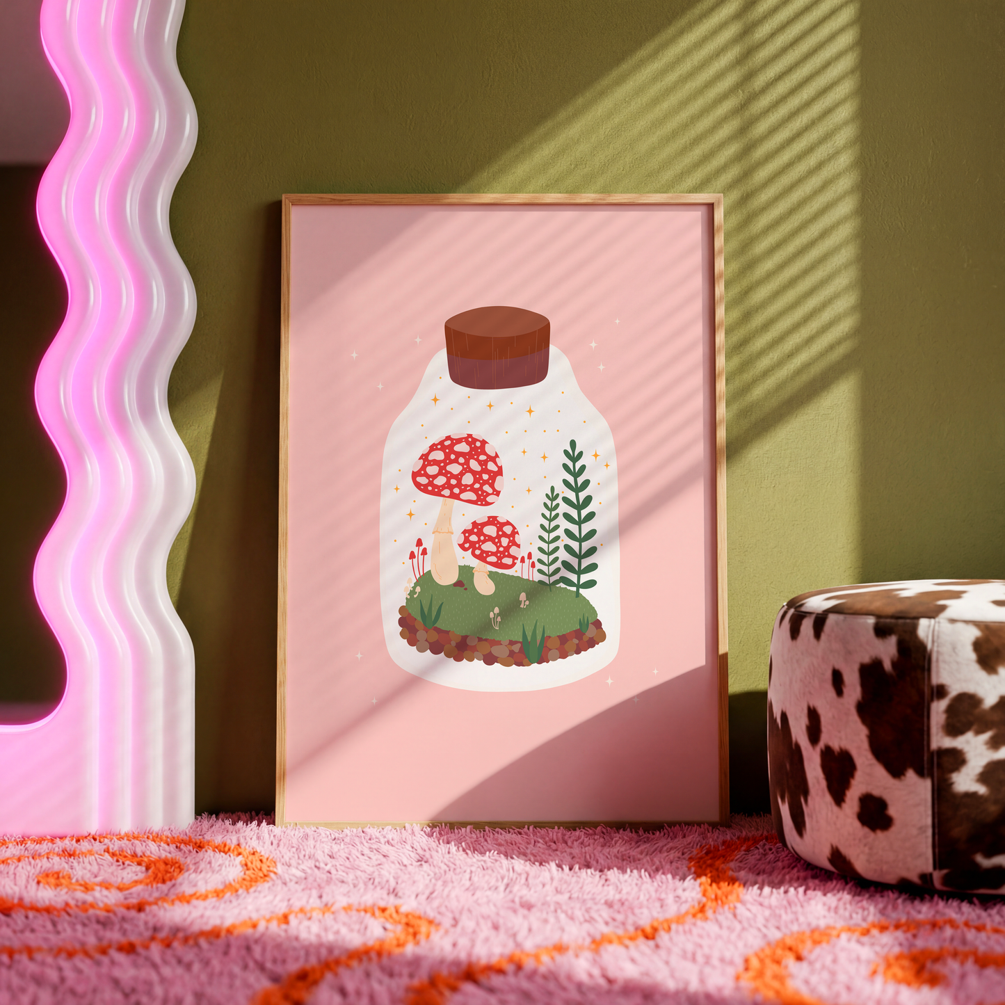 An illustration of a terrarium jar with toadstools and greenery inside of it. The background of the illustration print is a soft warm pink.