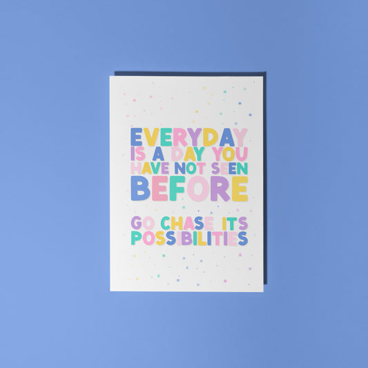 A greeting card with a positivity message; saying to go chase the possibilities of a new day.