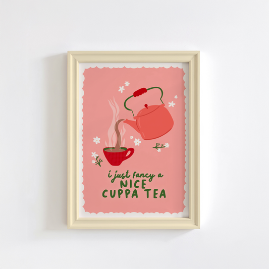 A print with a pink background, with a beige scalloped border, with an illustration of a vintage style kettle and a mug of tea. the quote at the bottom reads 'I just fancy a nice cuppa tea'