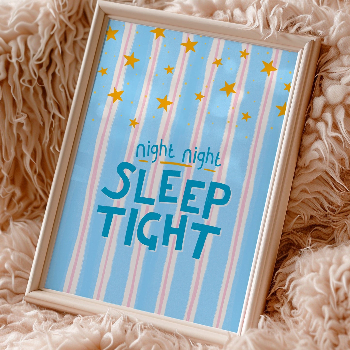 Framed picture with 'night night SLEEP TIGHT' text on a fluffy surface