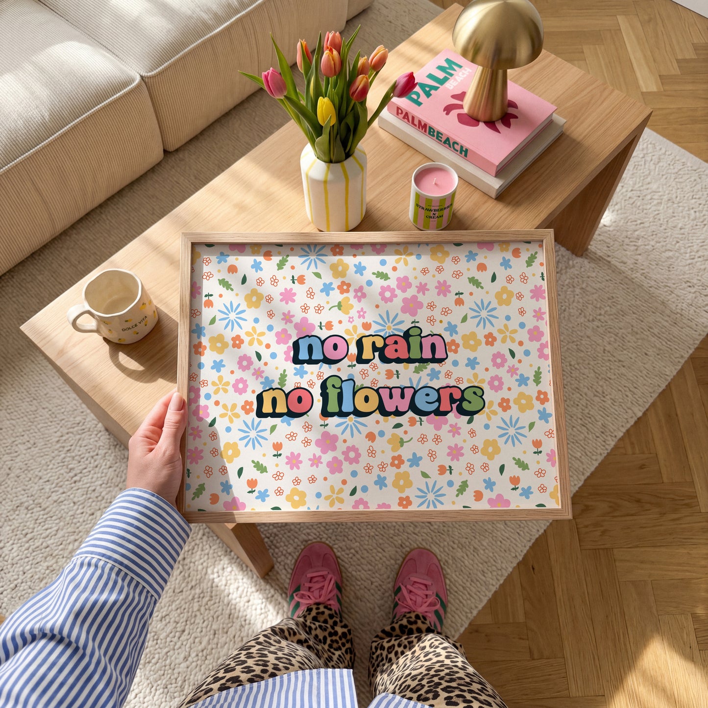 A colourful floral patterned print, with bright multi coloured text that reads 'no rain no flowers' in the centre.