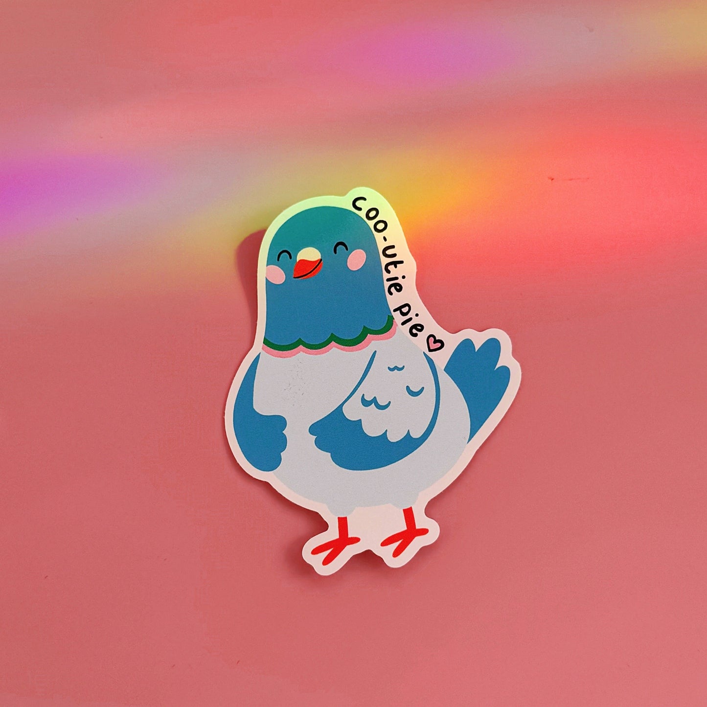 A waterproof vinyl sticker featuring an illustration of a pigeon and text that reads 'coo-utie pie'