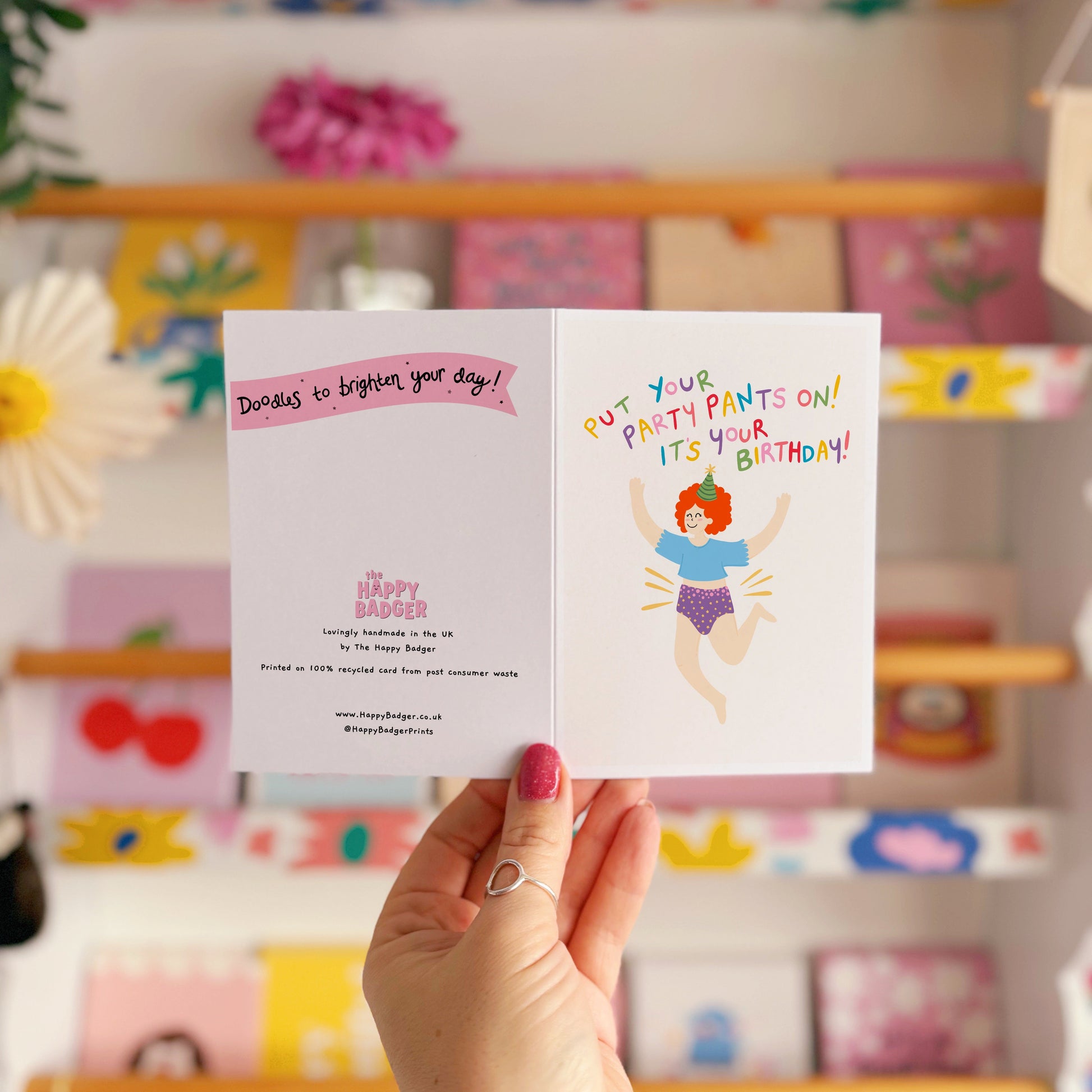 A colourful birthday card with a person jumping for joy wearing their underwear, with text that reads 'put your party pants on! it's your birthday!'
