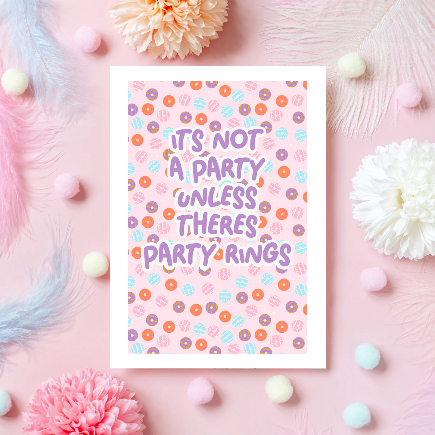 A birthday card, with a party ring pattern, and the text says 'it's not a party unless there's party rings'