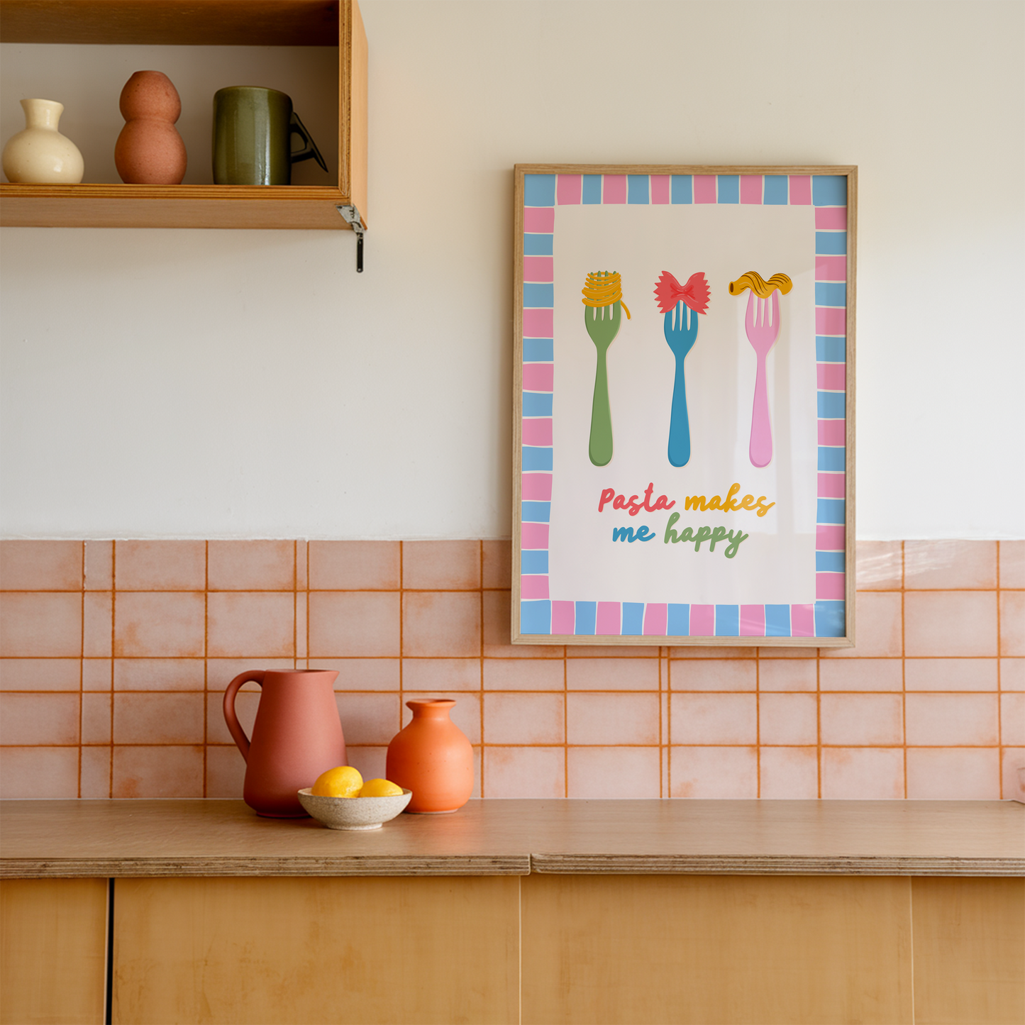 A colourful kitchen print with illustrations of pasta on forks, and a pasta lover quote. Framed by a hand drawn pink and blue border.