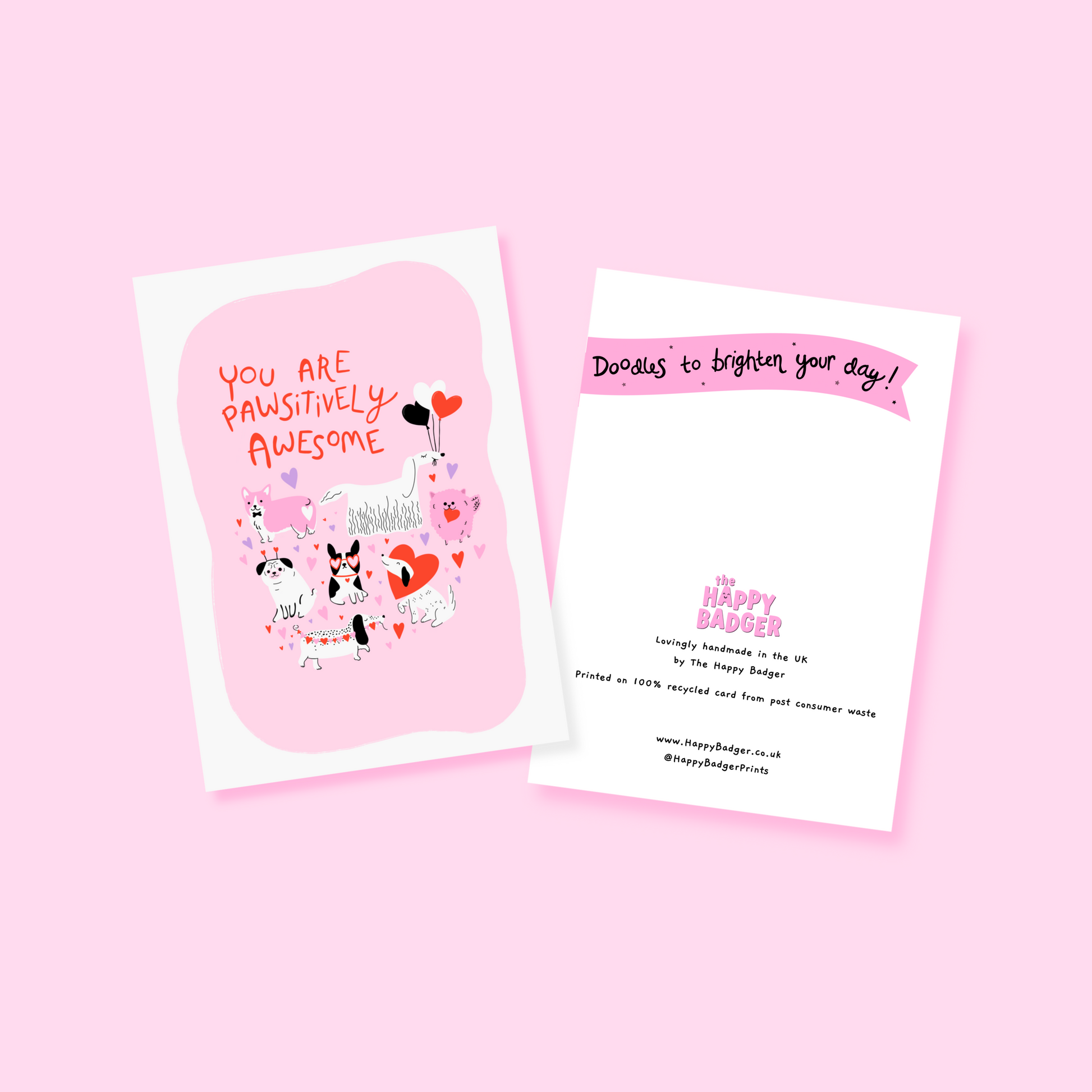 A greetings card for love and appreciation, showing 7 quirky dog illustrations surrounded by hearts and love themed elements. The text on the card is red and says 'You are pawsitively awesome'