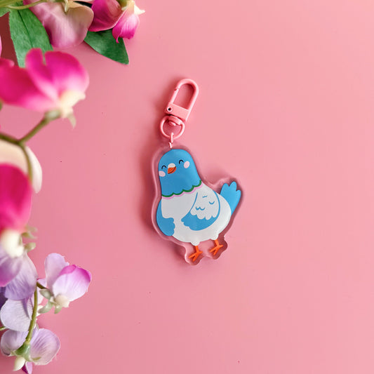 A cute blue pigeon keyring, with a pink clasp.