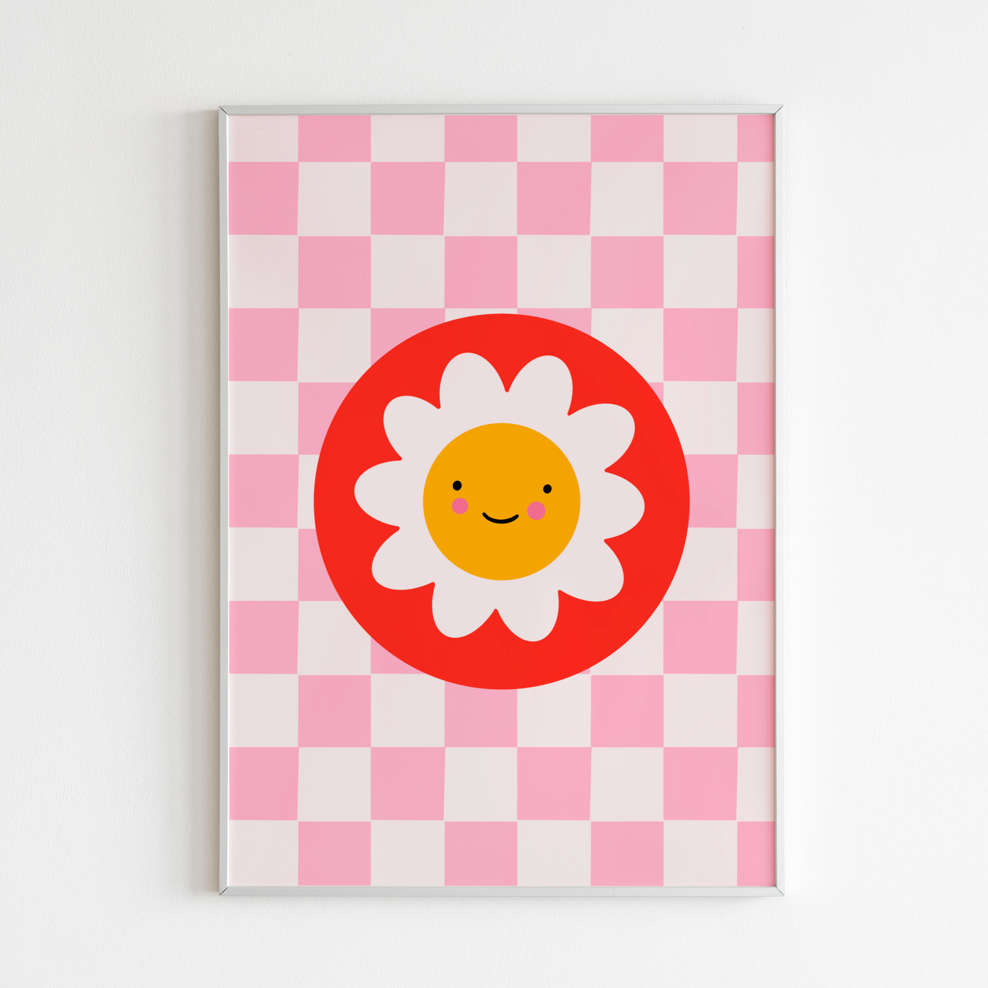 An illustration of a pink checkerboard print, with a smiling daisy in a red circle, shown in a frame.