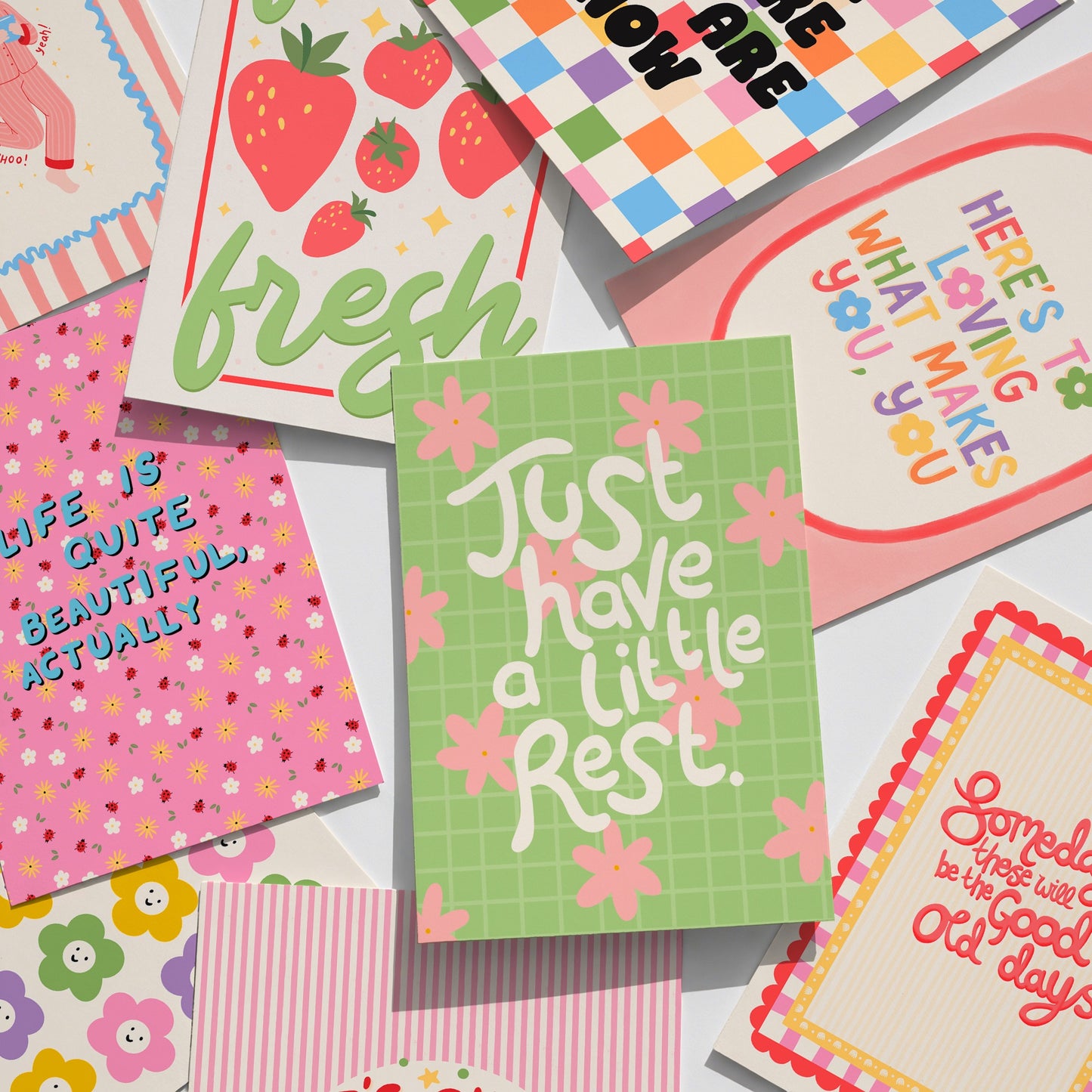 A collection of colourful prints with positive quotes on