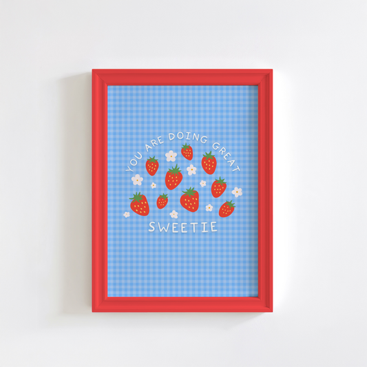 A blue gingham print, with white text that reads 'you are doing great sweetie' wrapped around strawberry and daisy illustrations in the centre.