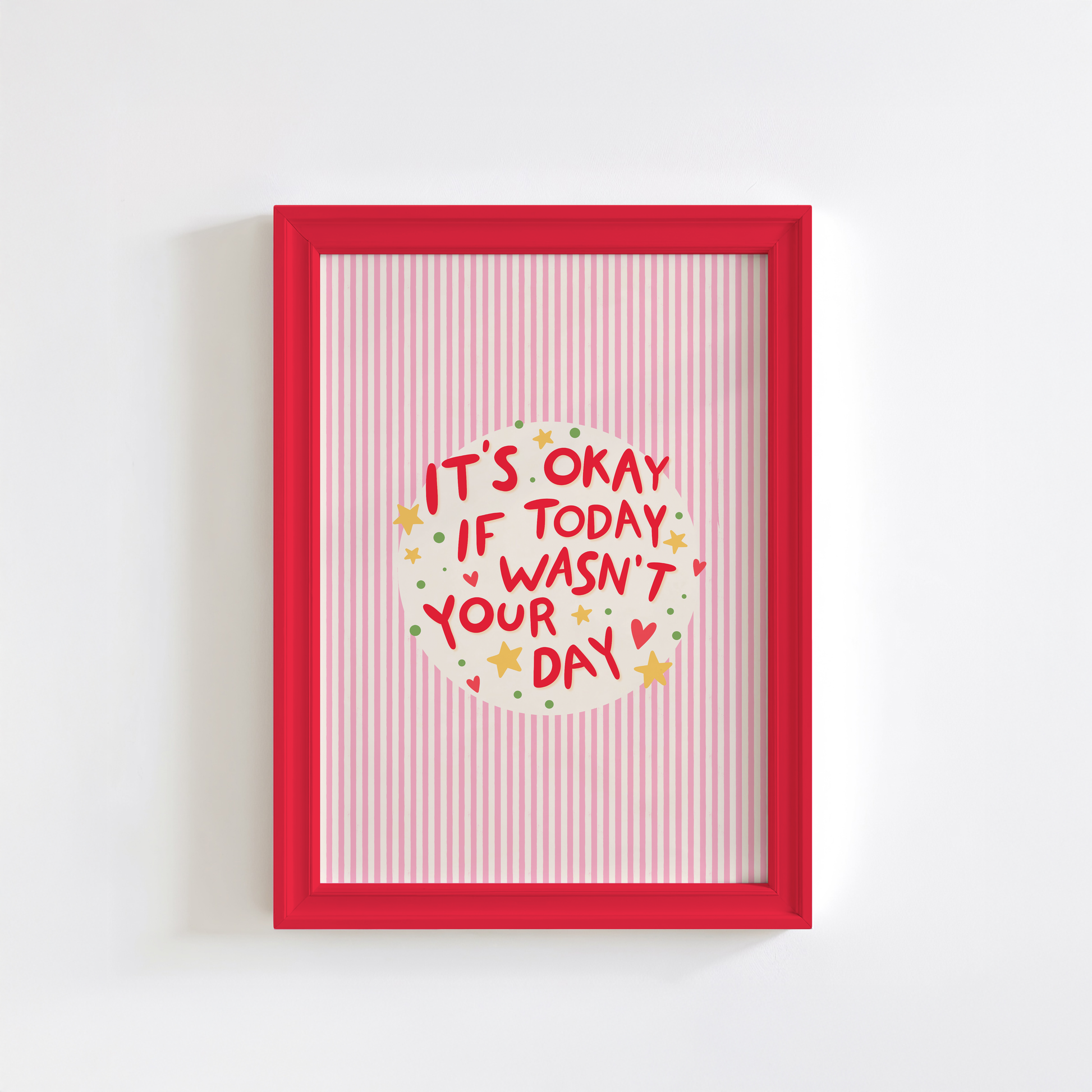 A red striped artwork, shown in a frame, with a motivational quote in the centre, decorated with stars and hearts.
