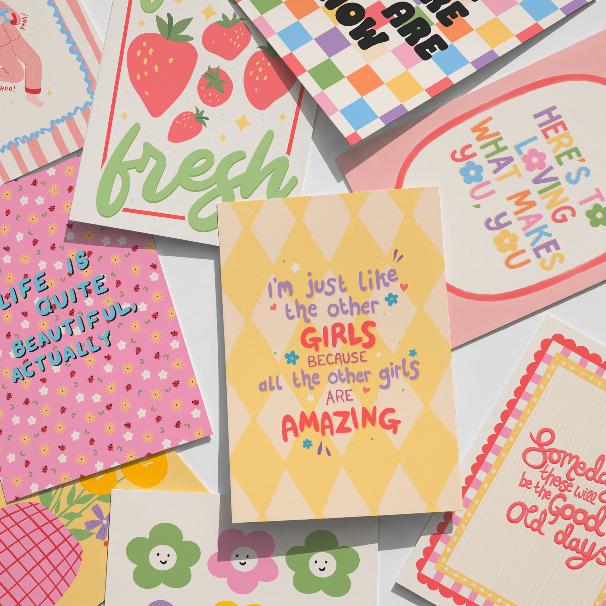 Collection of colourful prints with various positive quotes.