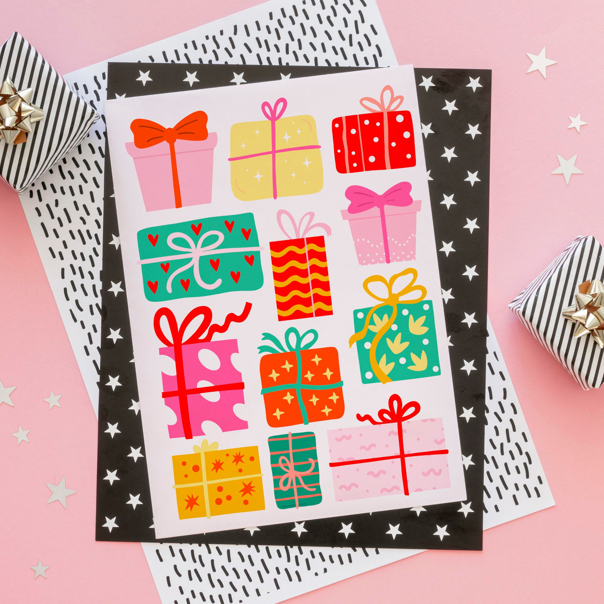 An illustrated Christmas print featuring lots of brightly coloured wrapped up Christmas presents on a pinkish white background.