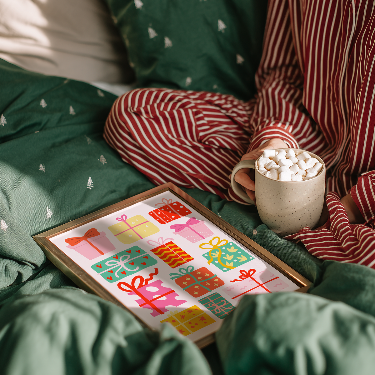 An illustrated Christmas print featuring lots of brightly coloured wrapped up Christmas presents on a pinkish white background.
