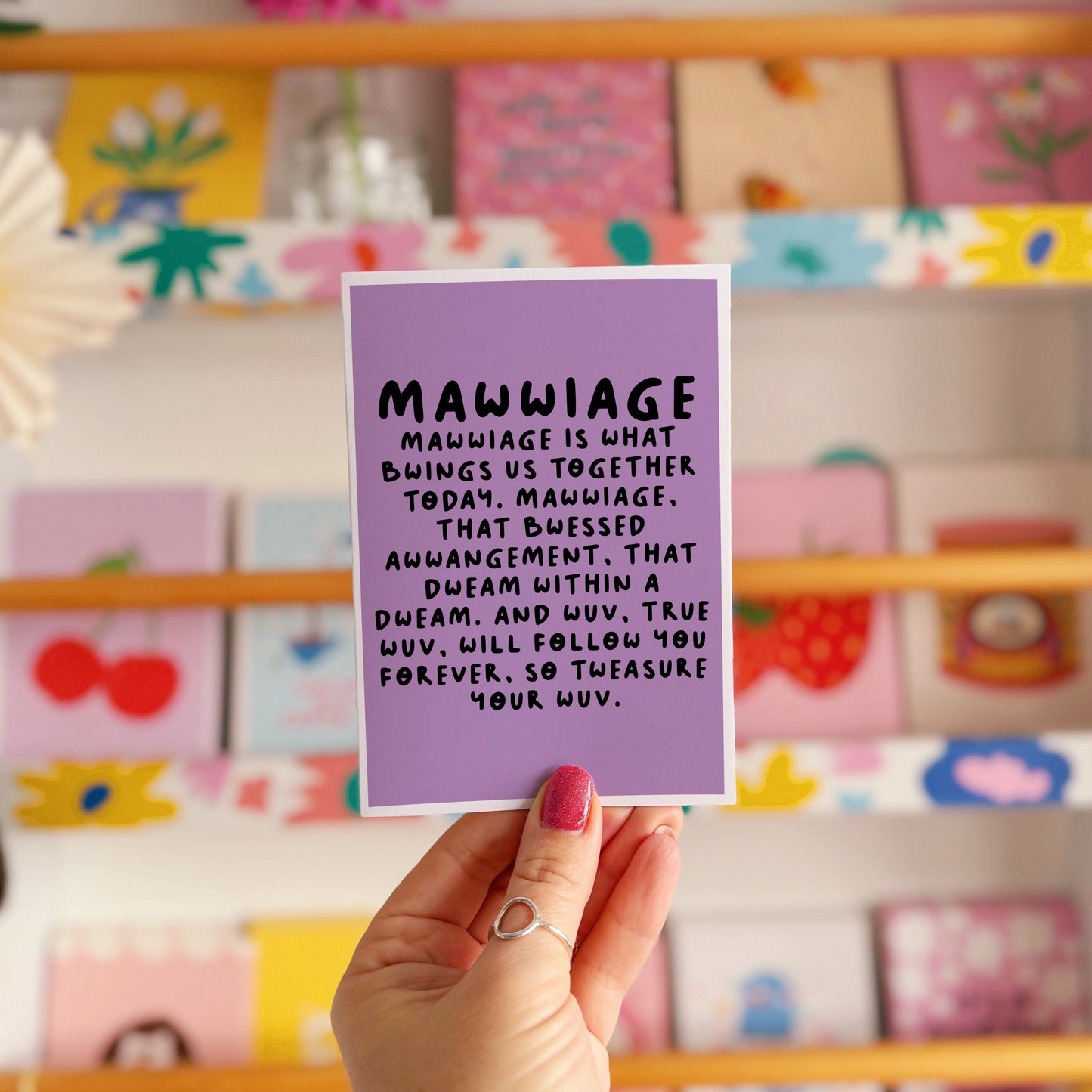 A purple wedding day celebration card, with a quote in black, from the film The Princess Bride.