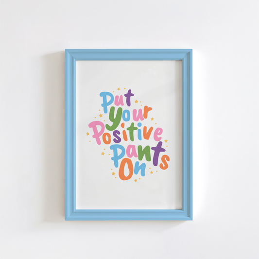 A colourful quote print that says 'put your positive pants on'.