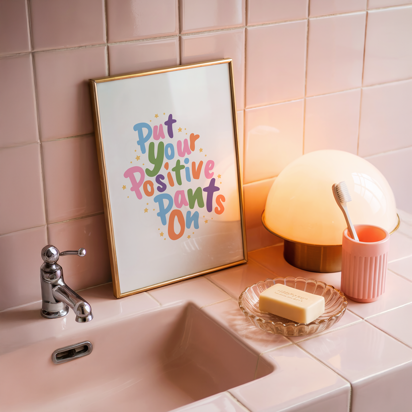 A colourful quote print that says 'put your positive pants on'.