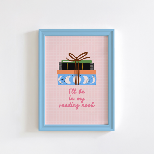 A cute pink print, featuring an illustration of a pack of books, and the quote 'I'll be in my reading nook' underneath.