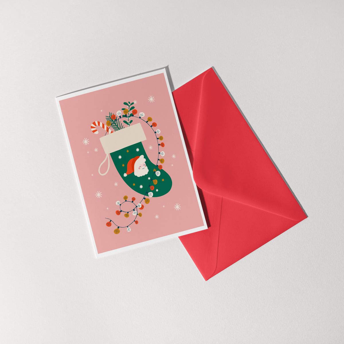 A festive Christmas card with an illustration of a Christmas stocking with Father Christmas on the front.