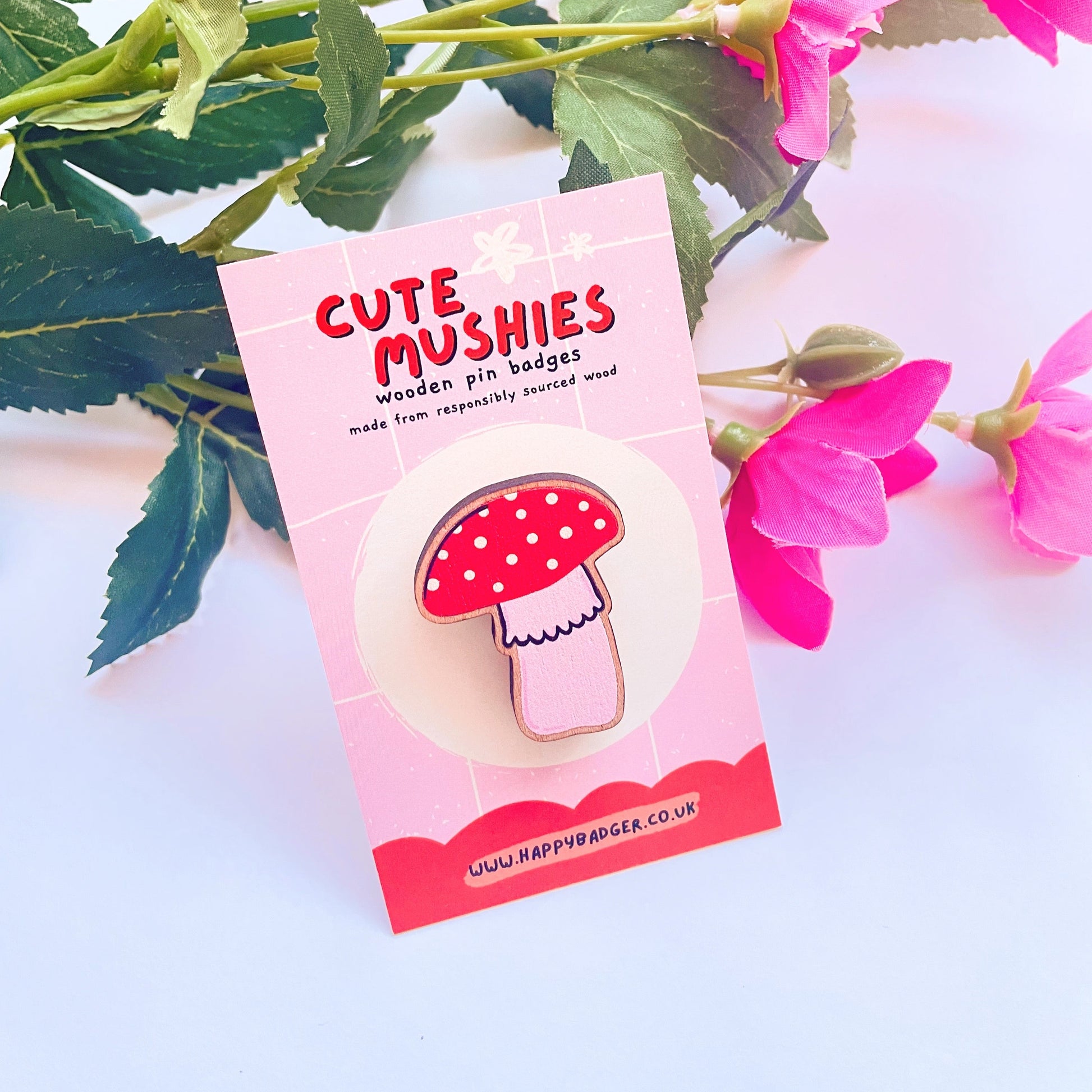 A wooden eco friendly pin badge of a cute skinny mushroom.