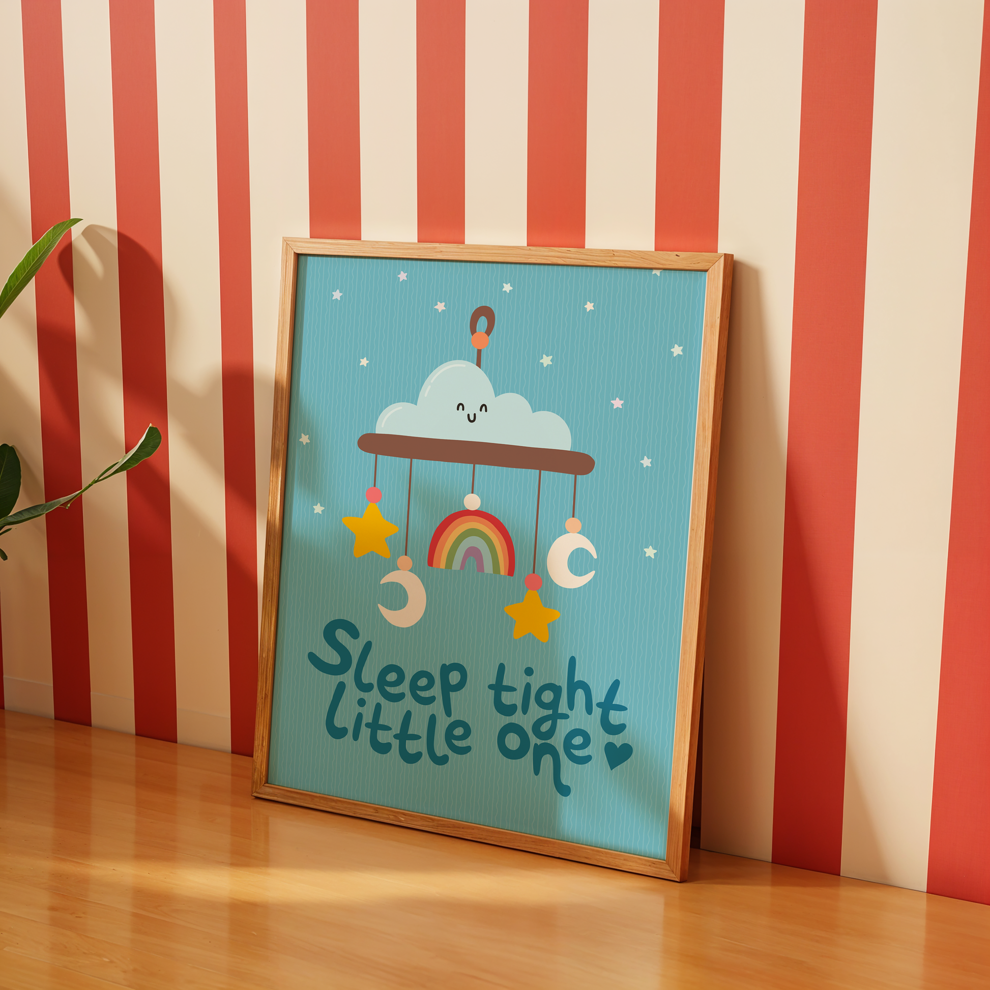 A blue print with an illustration of a children's mobile, and the words 'sleep tight little one' underneath.
