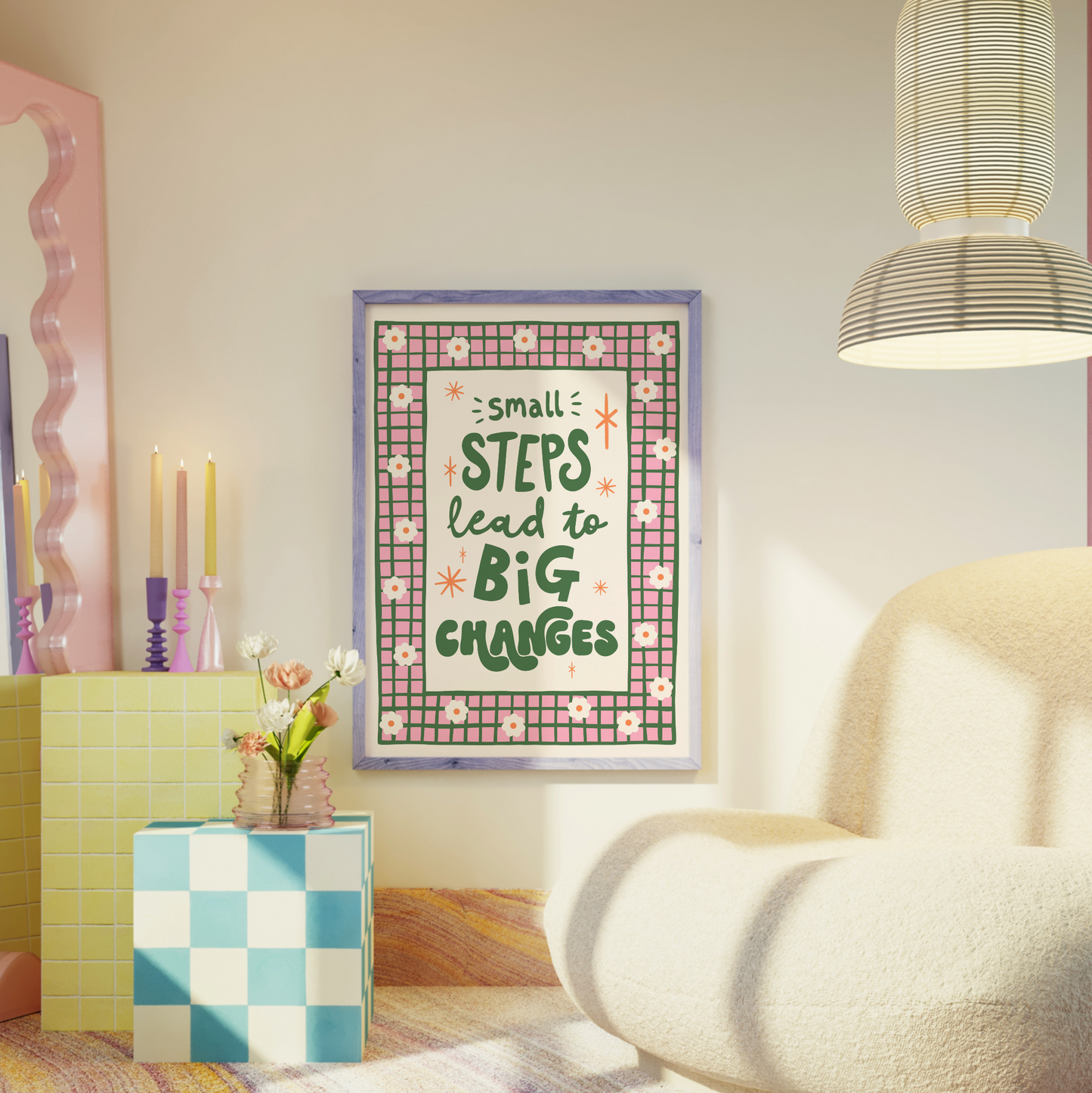 A positive quote print that reads 'small steps lead to big changes' in green hand writing. Around the quote is a hand drawn pink and green checkered border with daisy doodles.