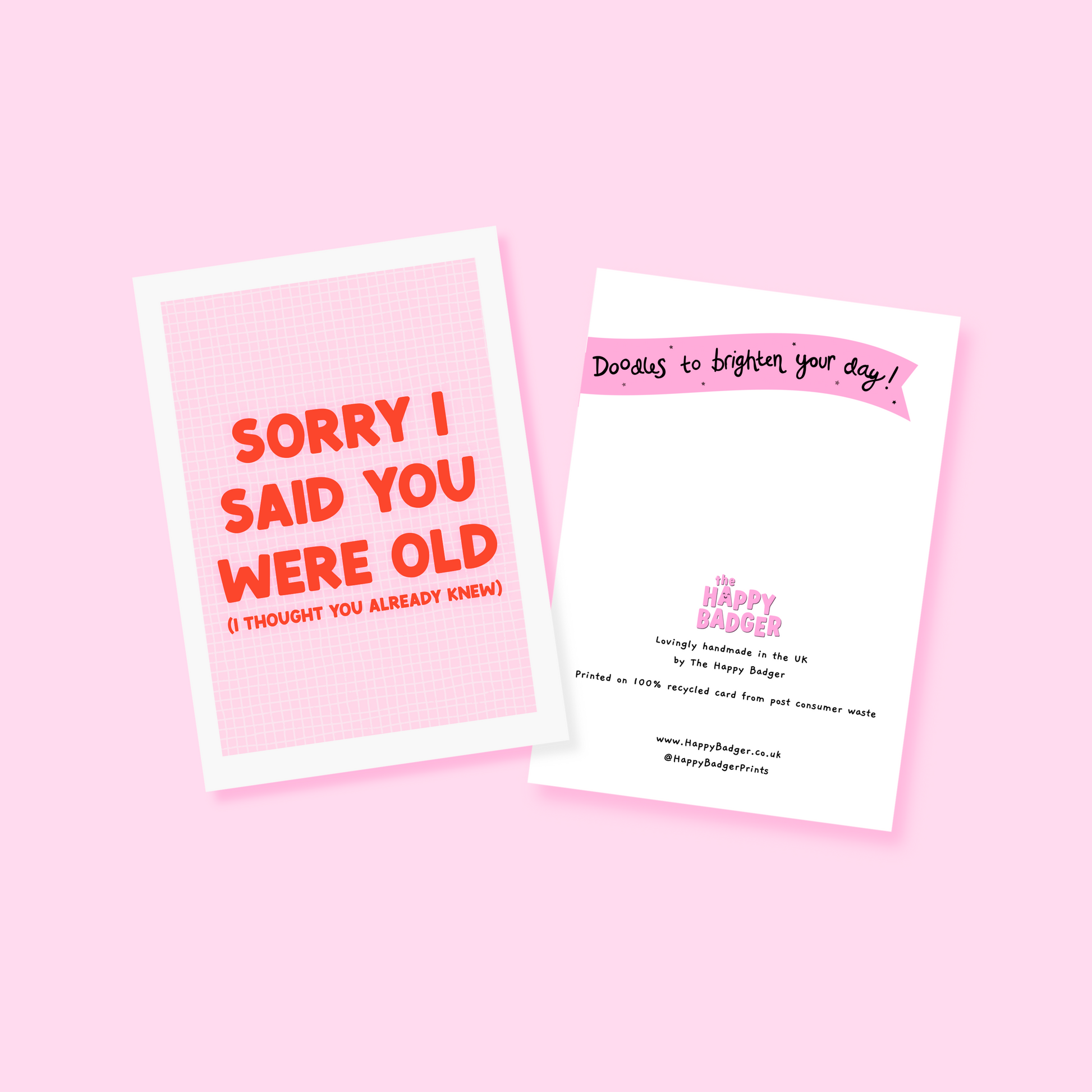 A pink and red birthday card, with a humorous saying on the front - "Sorry I Said You Were Old (I thought you already knew)"