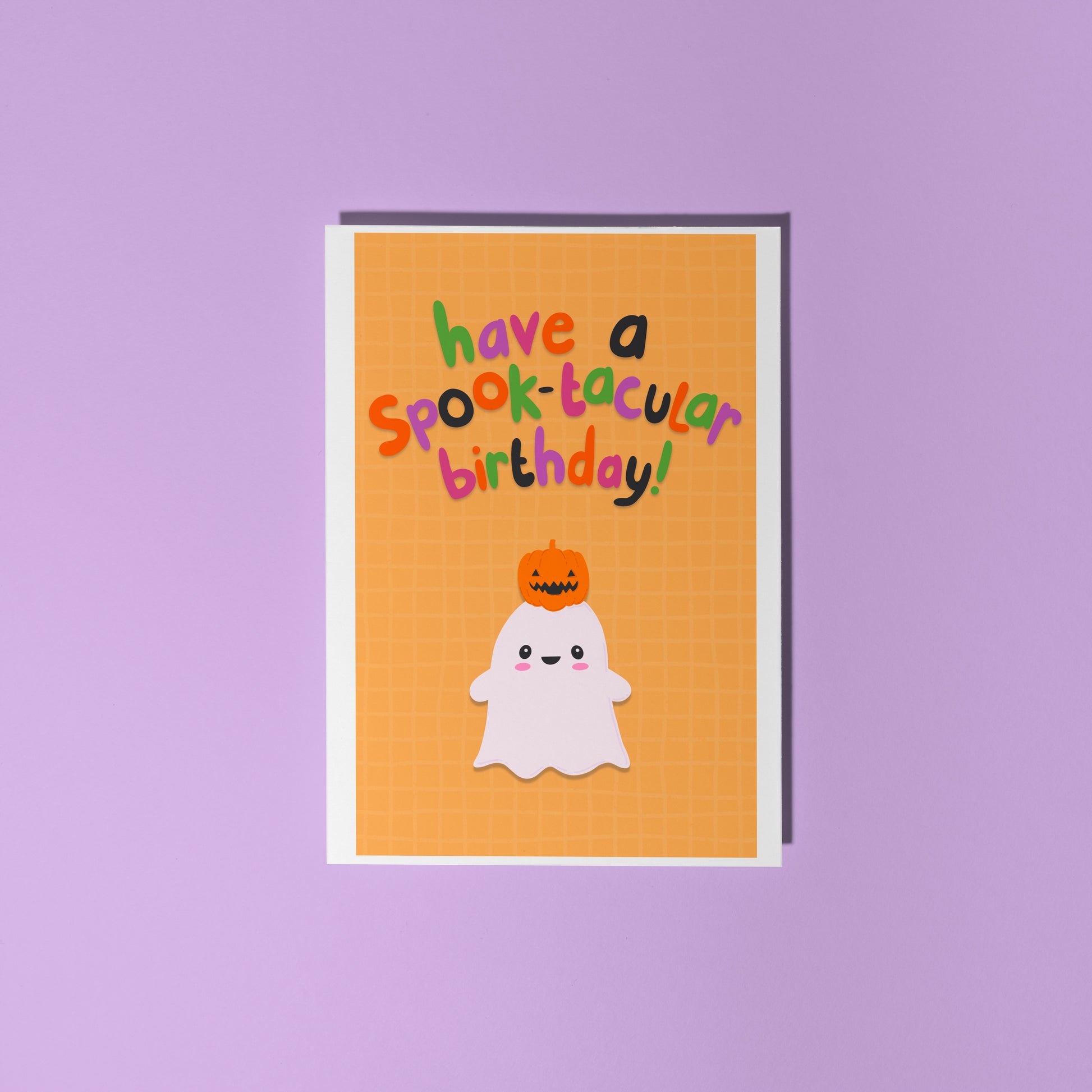 Halloween-themed birthday card with ghost and pumpkin on a purple background