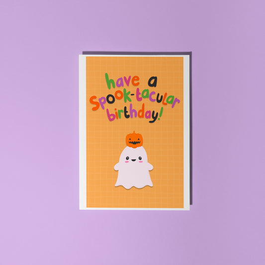 Halloween-themed birthday card with ghost and pumpkin on a purple background