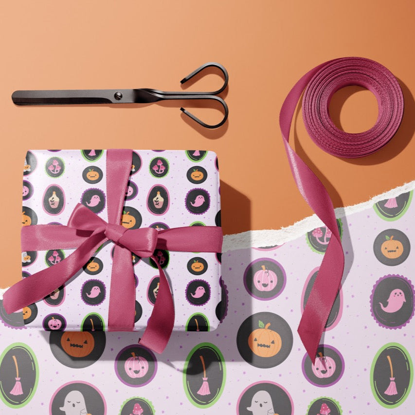 A gift wrapped present, wrapped up in a cute halloween print gift wrap from The Happy Badger.