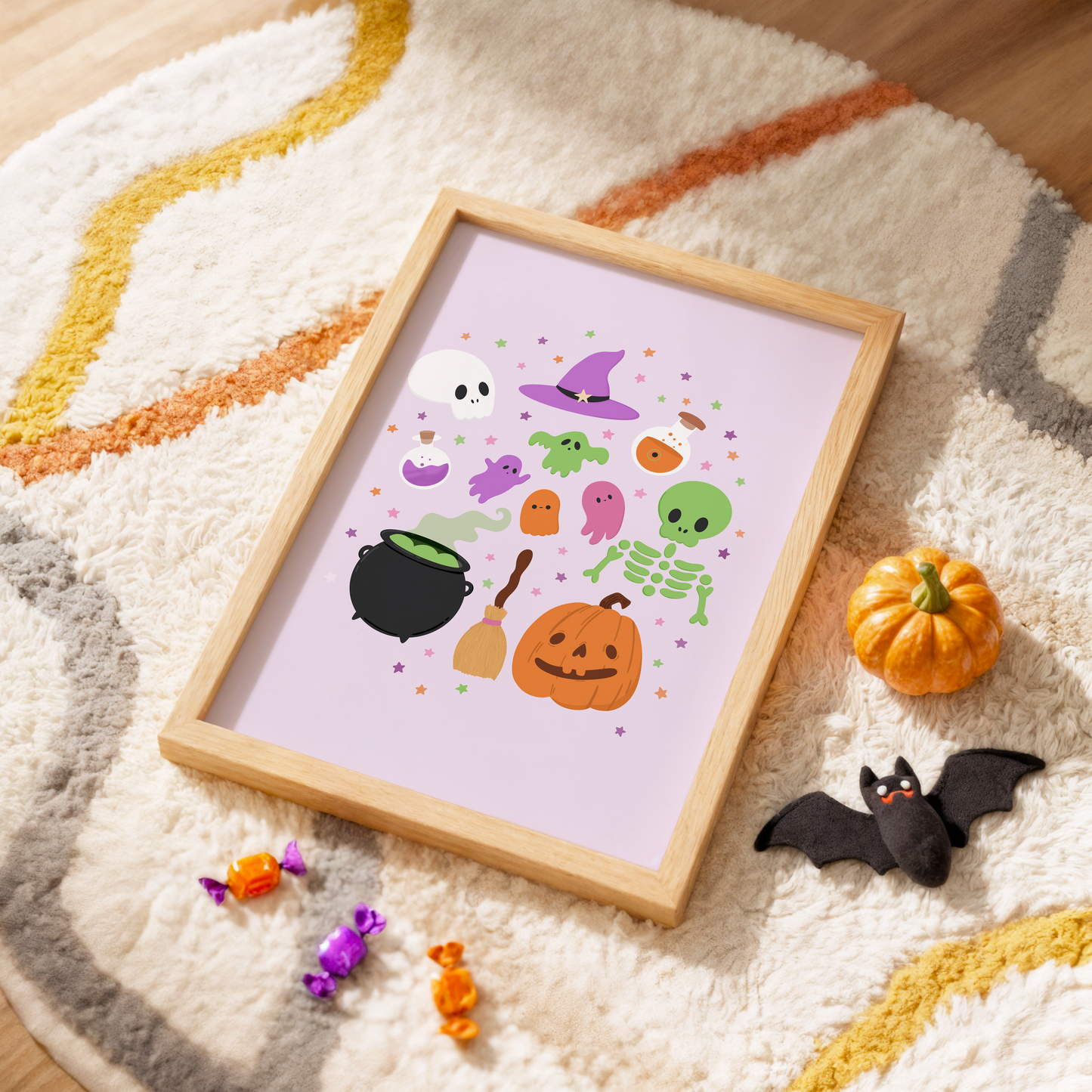 A Halloween illustration print on a light purple background, featuring lots of little Halloween themed doodles from pumpkins to skeletons and cauldrons to ghosts.