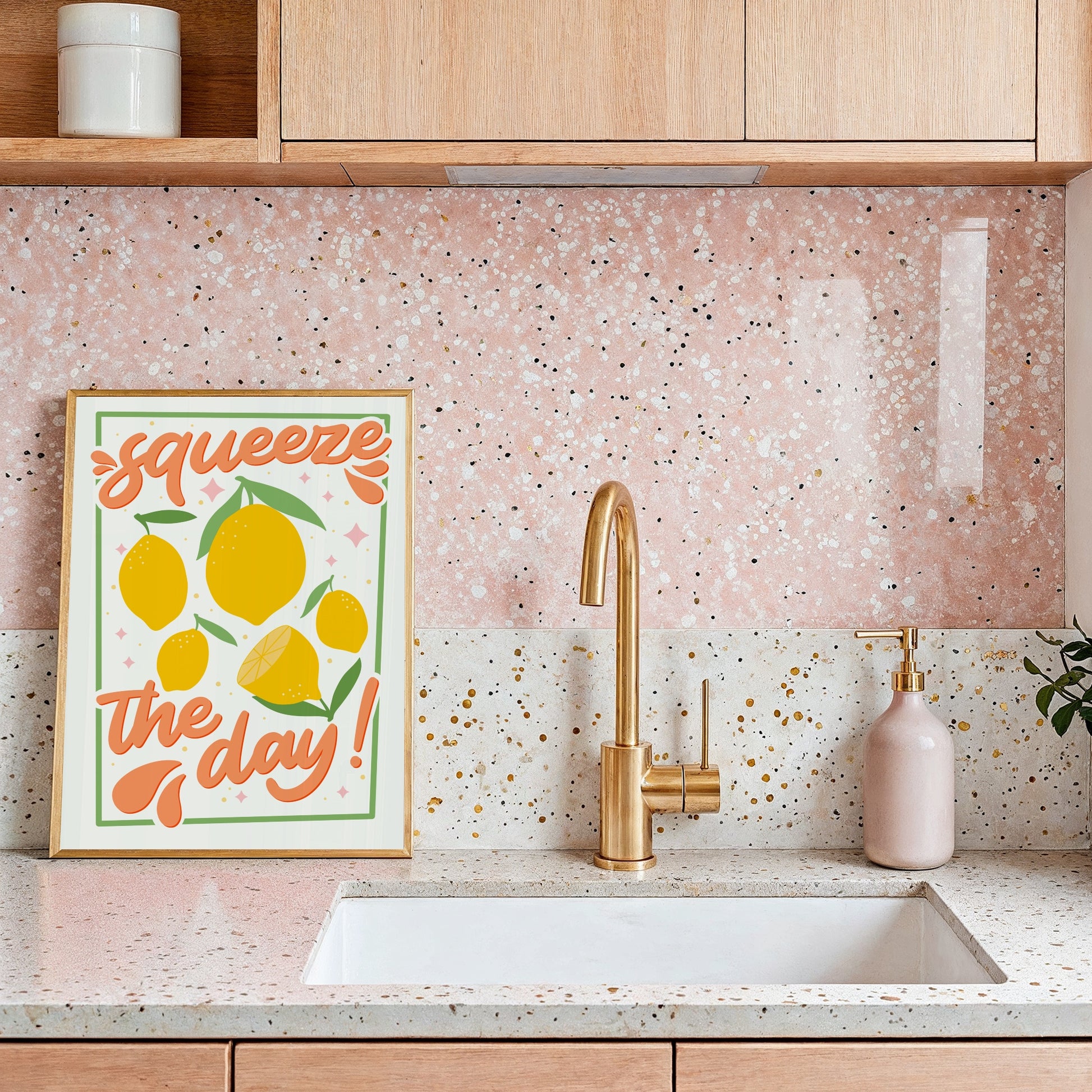An art print with the text 'squeeze the day!' surrounded by illustrations of lemons and leaves in shades of yellow, green, and orange.
