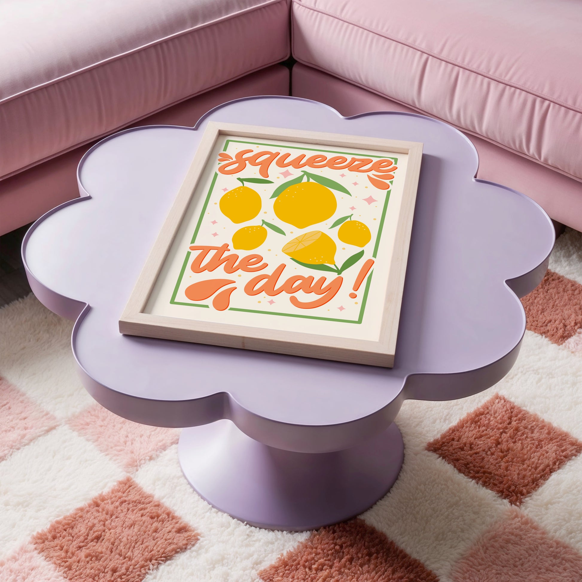 An art print with the text 'squeeze the day!' surrounded by illustrations of lemons and leaves in shades of yellow, green, and orange.