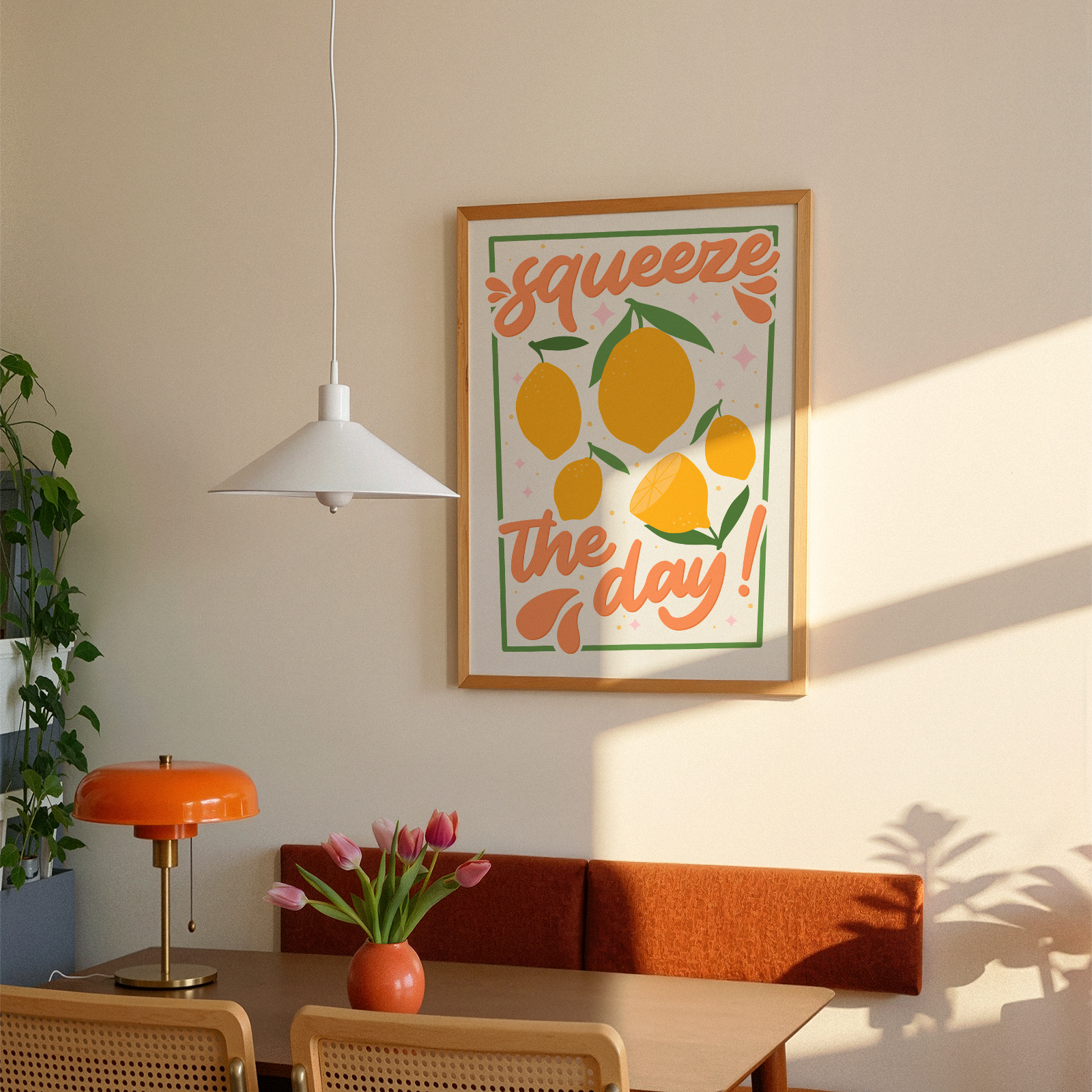 An art print with the text 'squeeze the day!' surrounded by illustrations of lemons and leaves in shades of yellow, green, and orange.