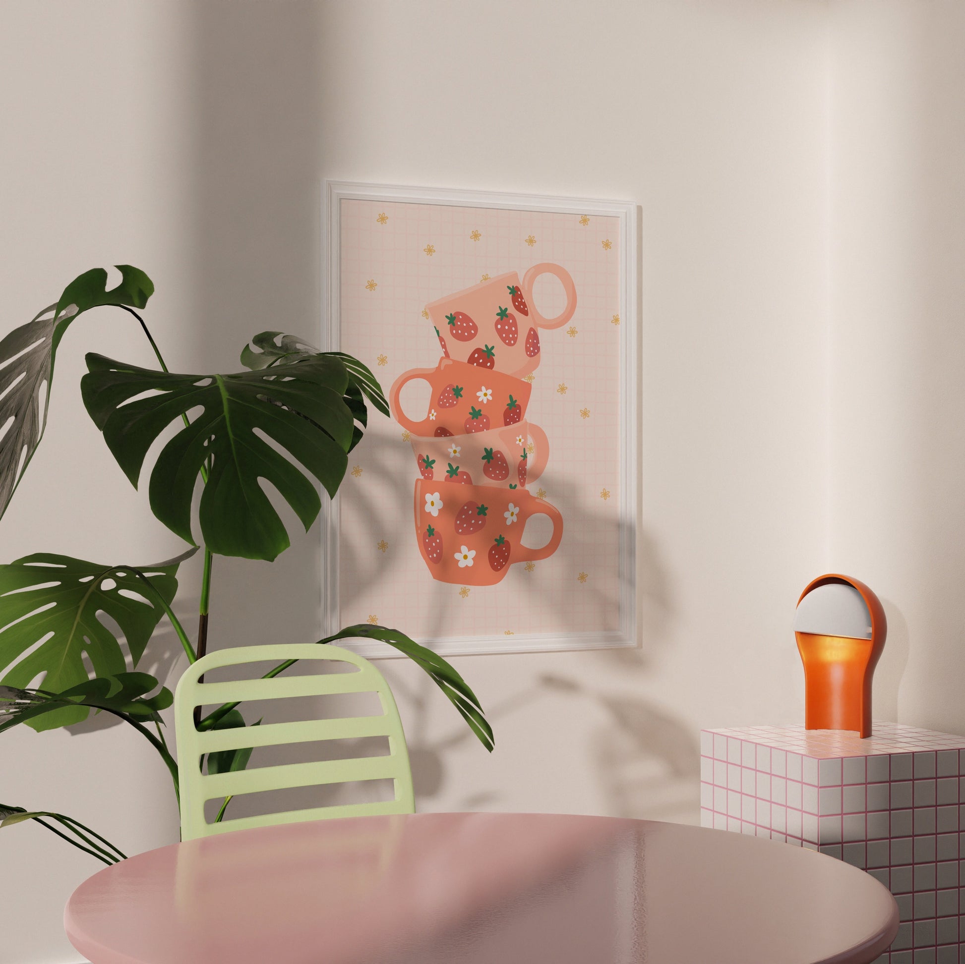 A stack of pink and orange mugs with strawberries on them, on a warm pale orange background.