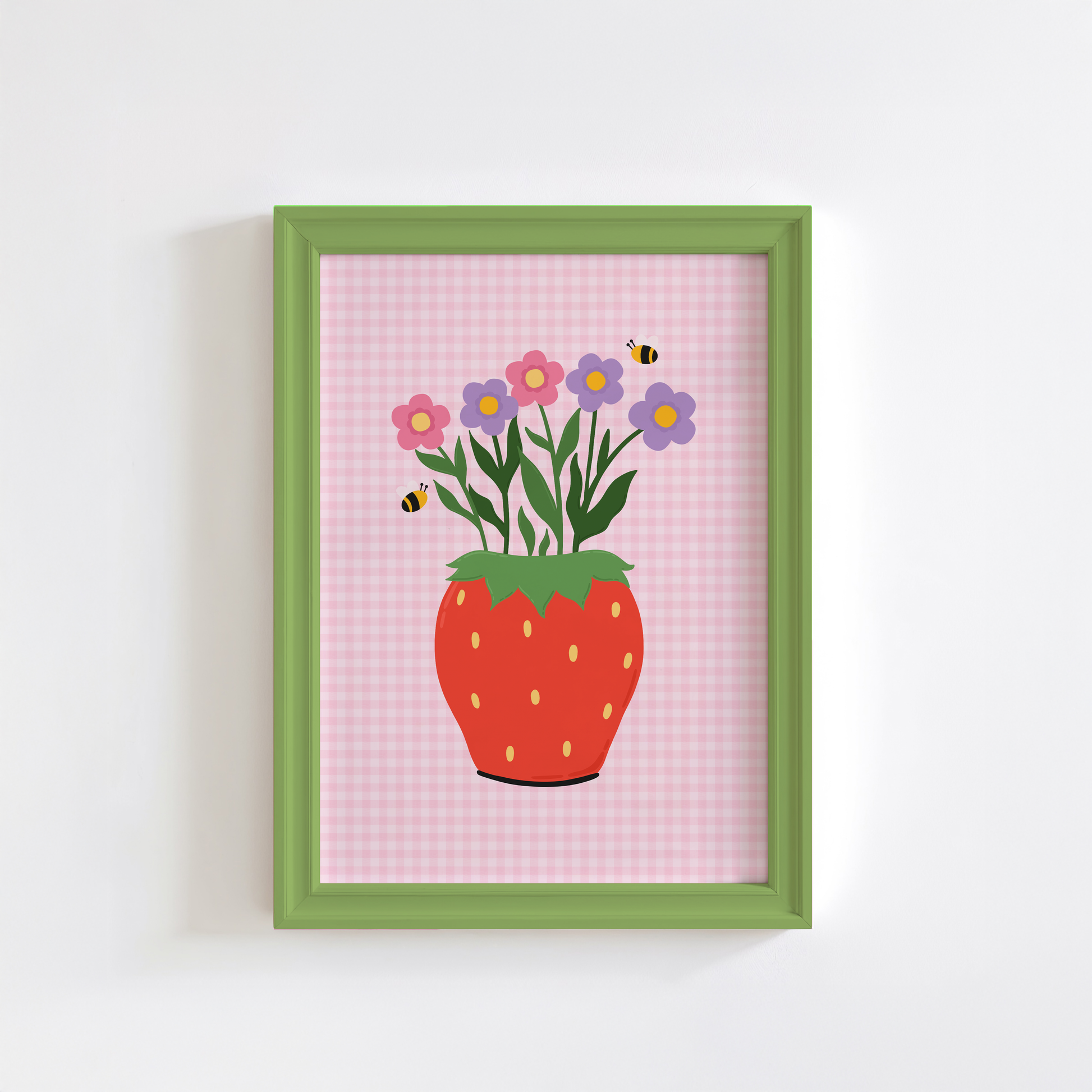 Framed artwork of a strawberry-shaped vase with flowers on a pink checkered background