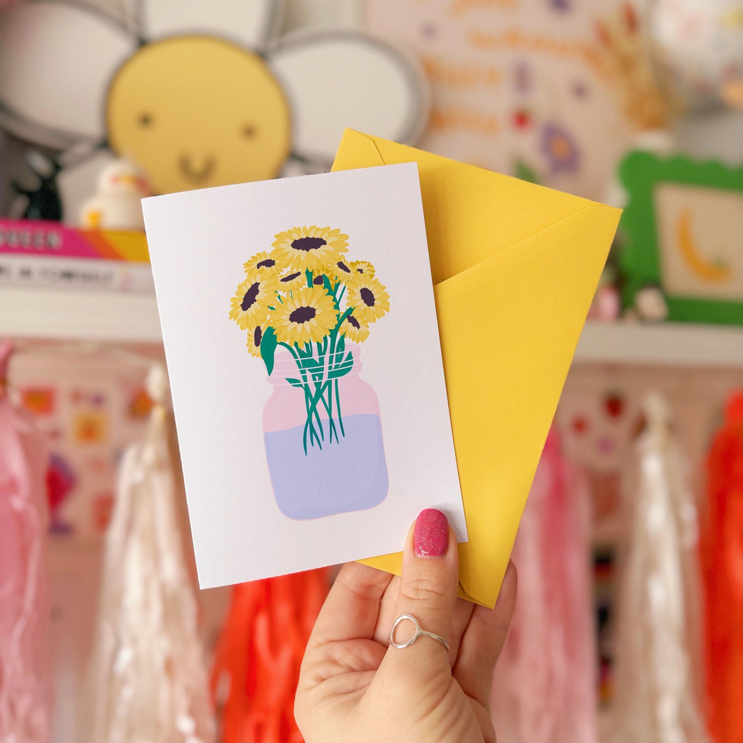 A greetings card with a bouquet of flowers, the card is otherwise blank to convey any sentiment.