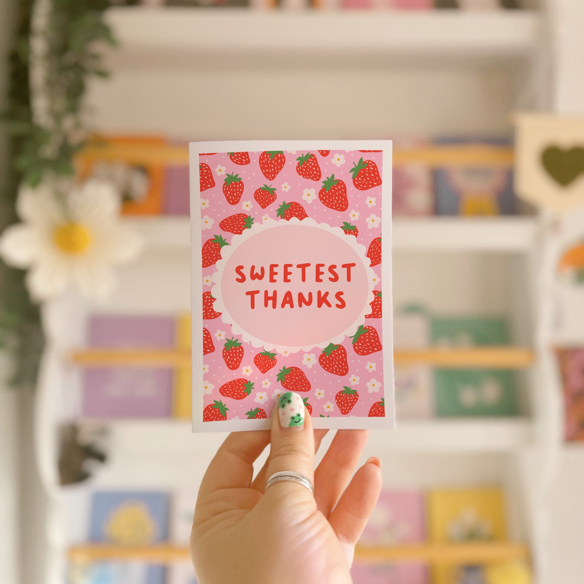 Thank you card with a strawberry pattern and the words 'Sweetest Thanks'.