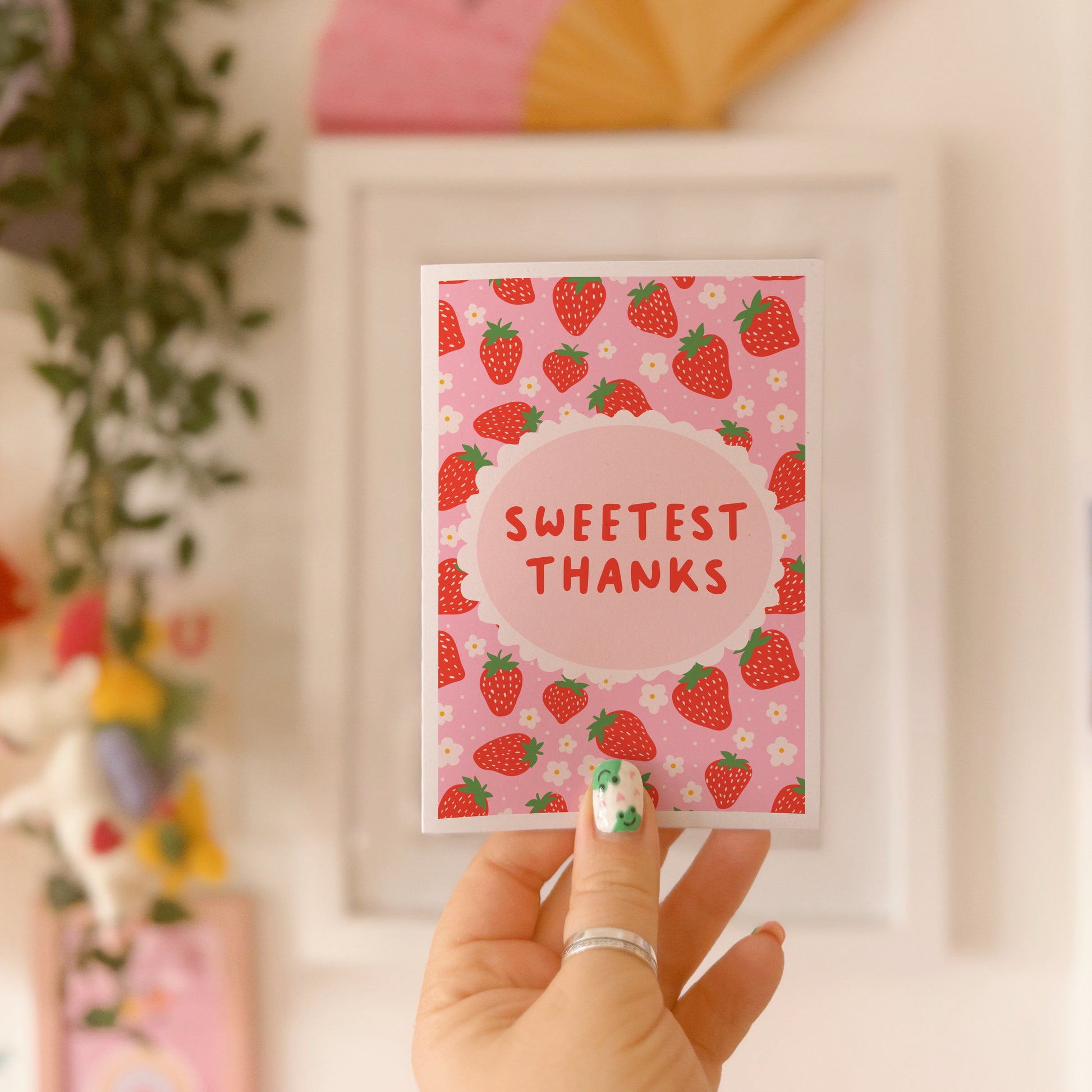 Thank you card with a strawberry pattern and the words 'Sweetest Thanks'.