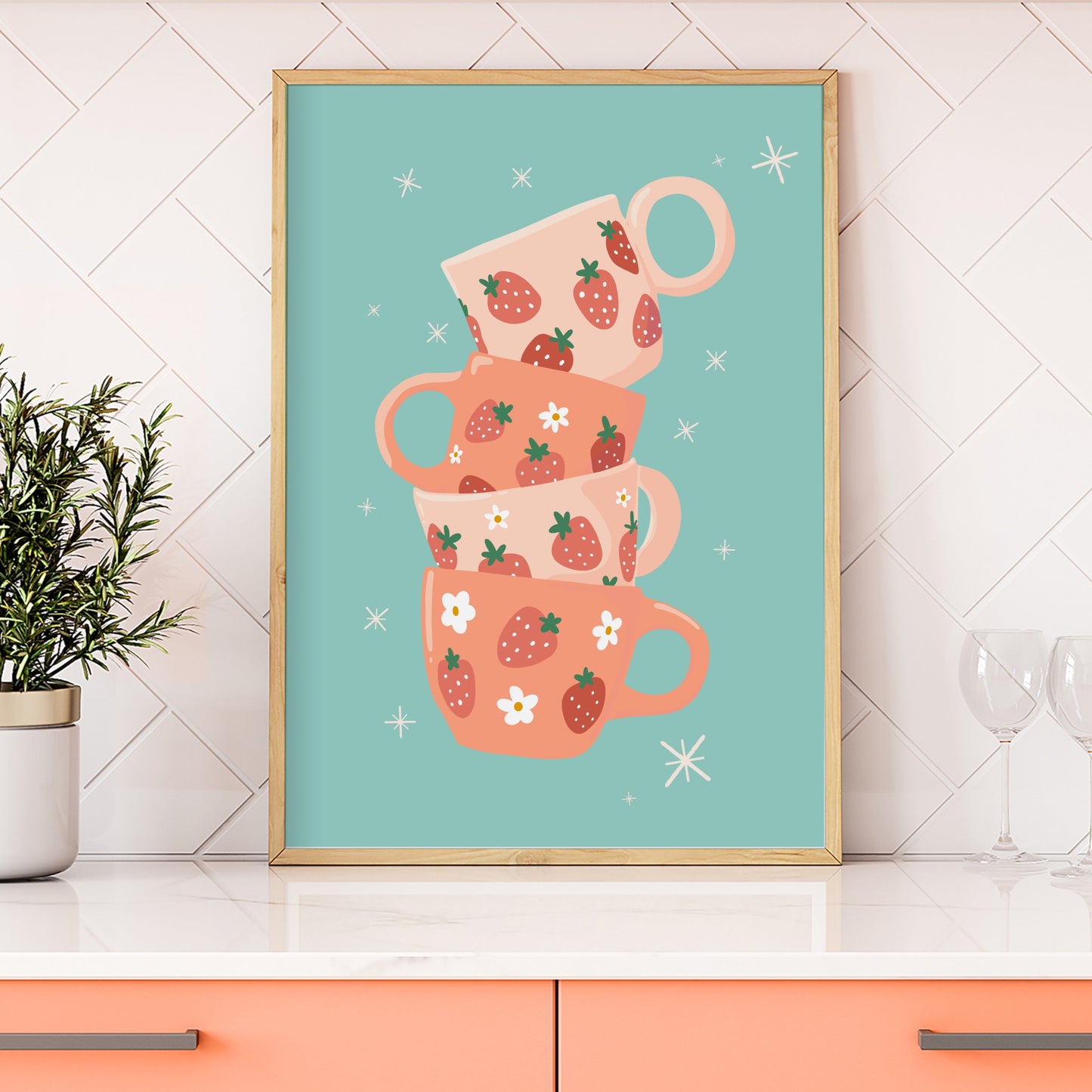 A stack of pink and orange mugs with strawberries on them, on a teal blue background.