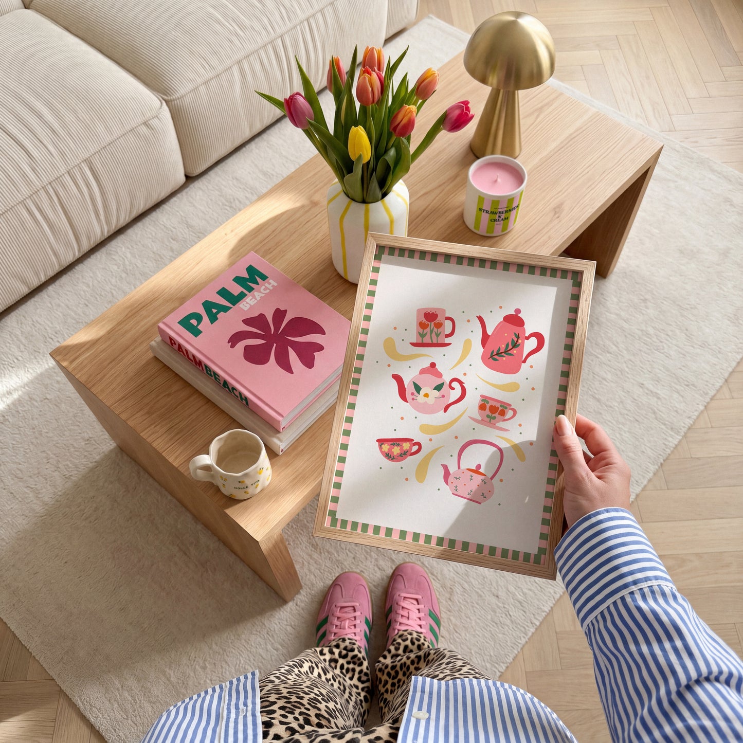 An illustration of 6 mugs and teapots in cosy autumnal colours. The print has a pink and green checkerboard border.