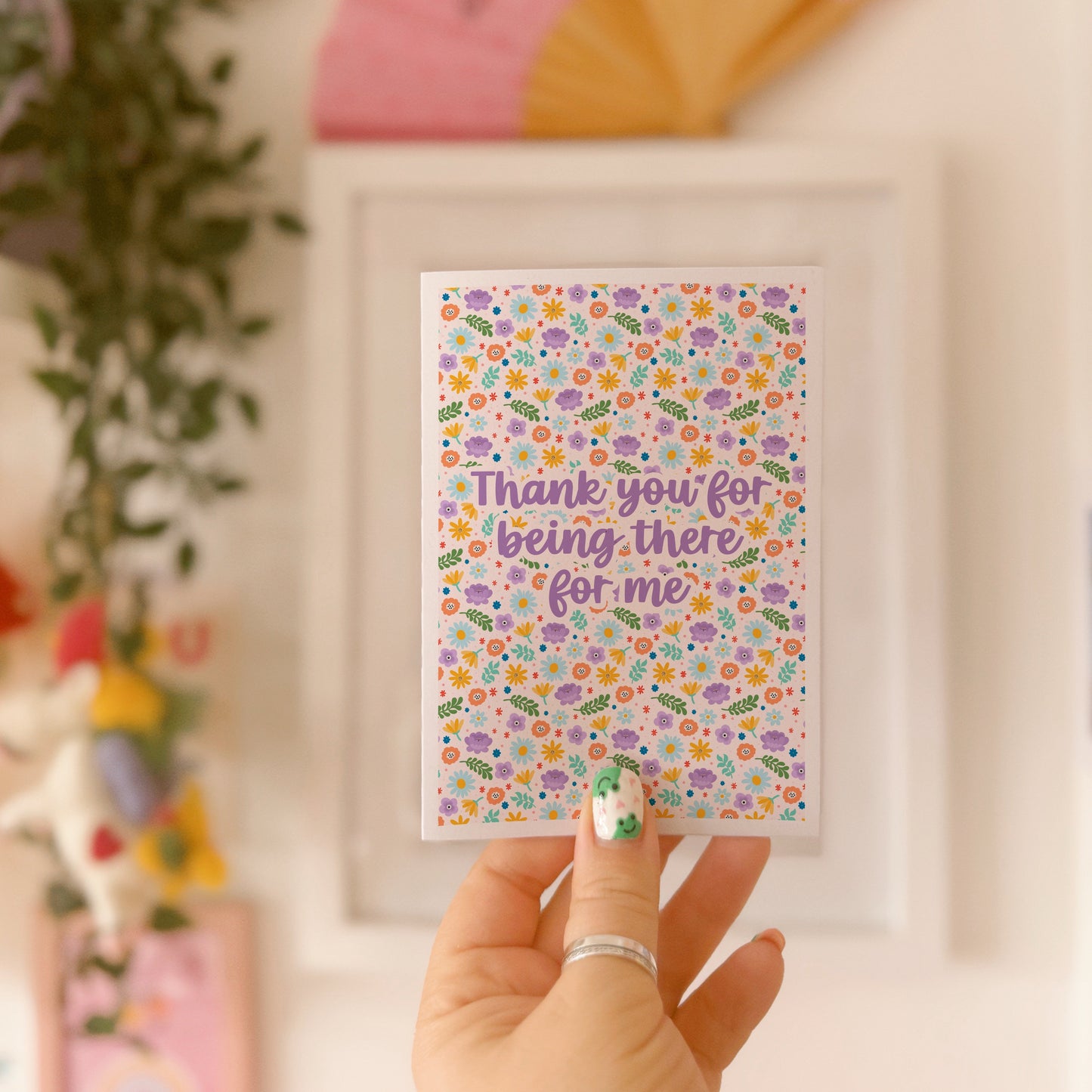 A colourful floral card with hand lettered text that reads 'thank you for being there for me'.